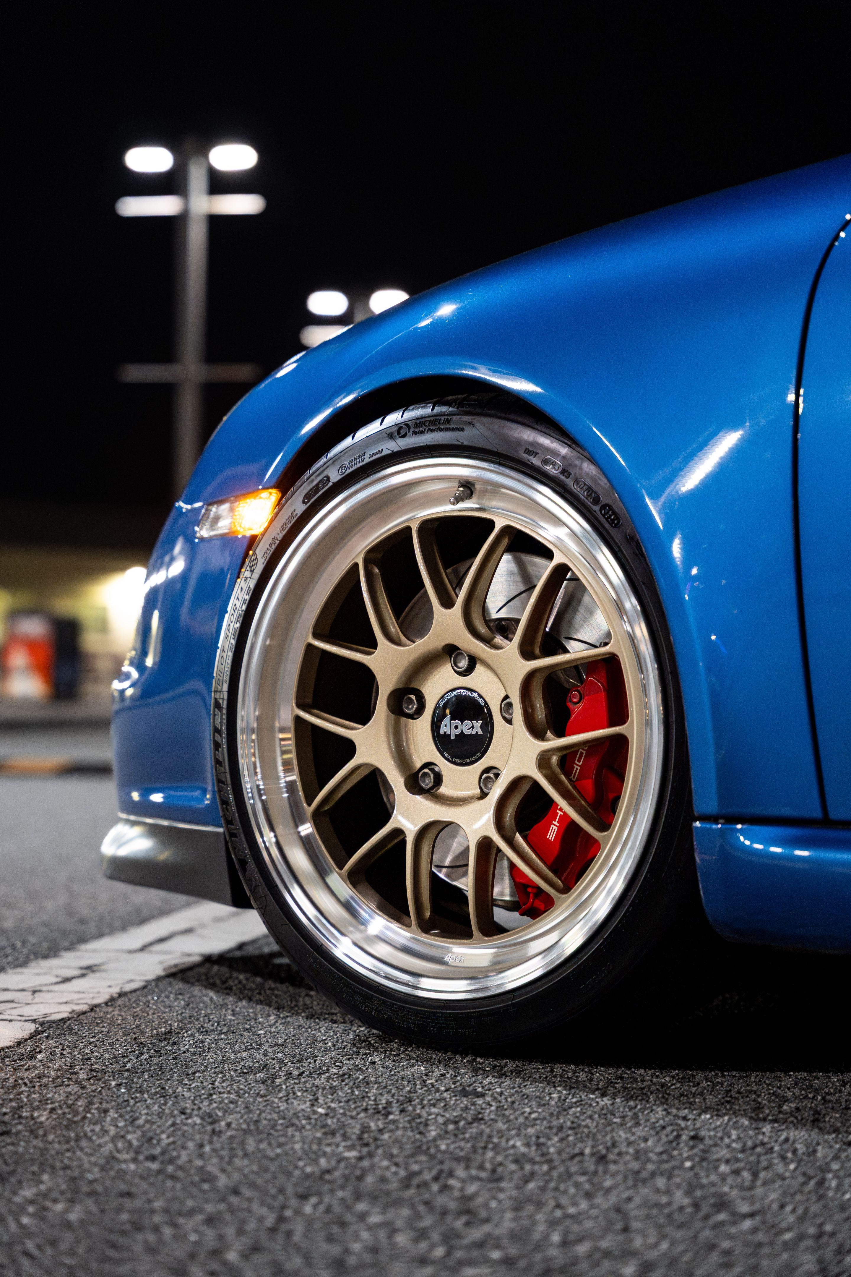 Blue Porsche 911 997 GT3 with 19" TEST-M Apex wheels in Machined Lip Gloss Motorsport Gold