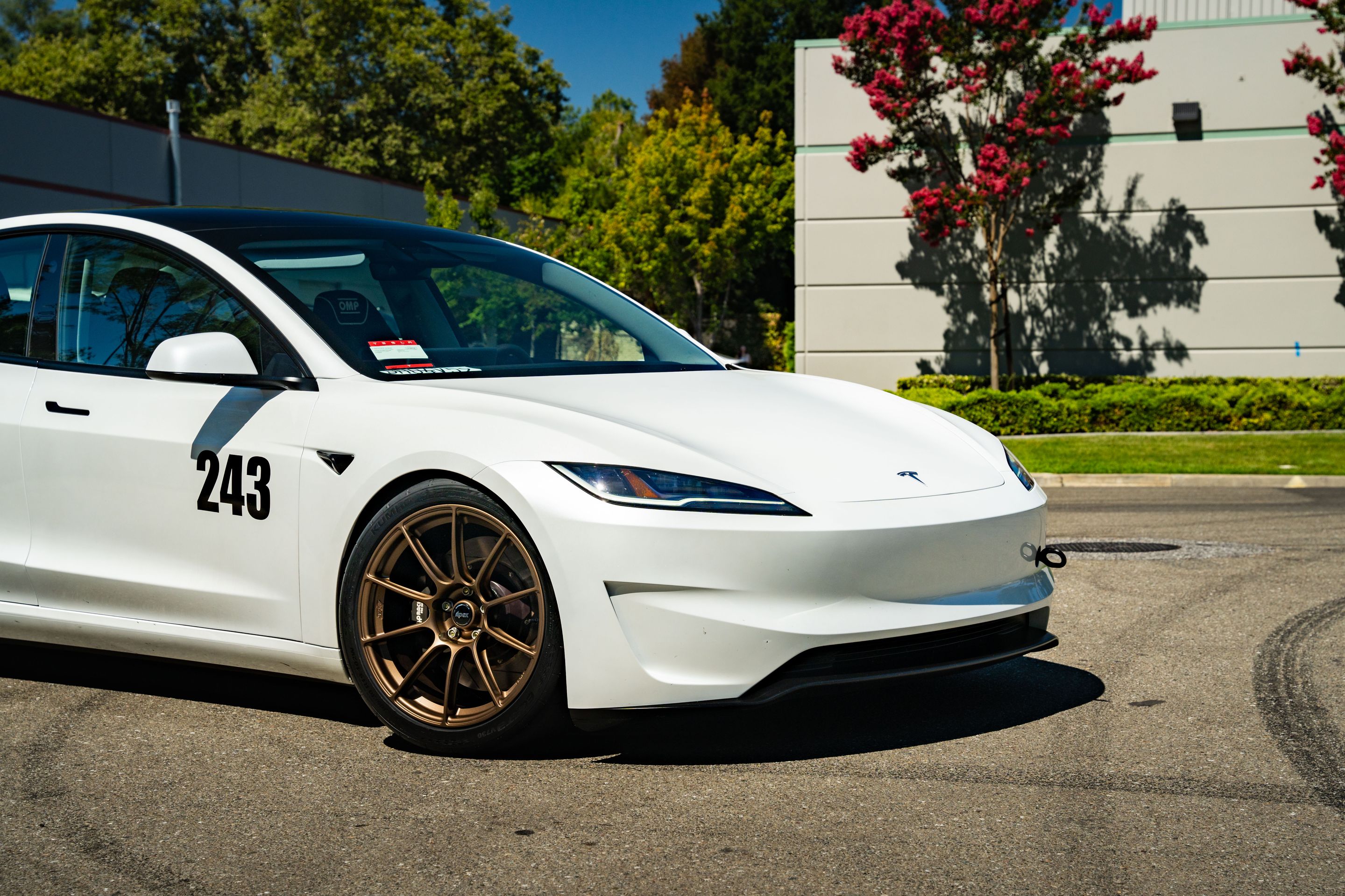 White Tesla Model 3 with 19" SM-10RS Apex wheels in Satin Bronze