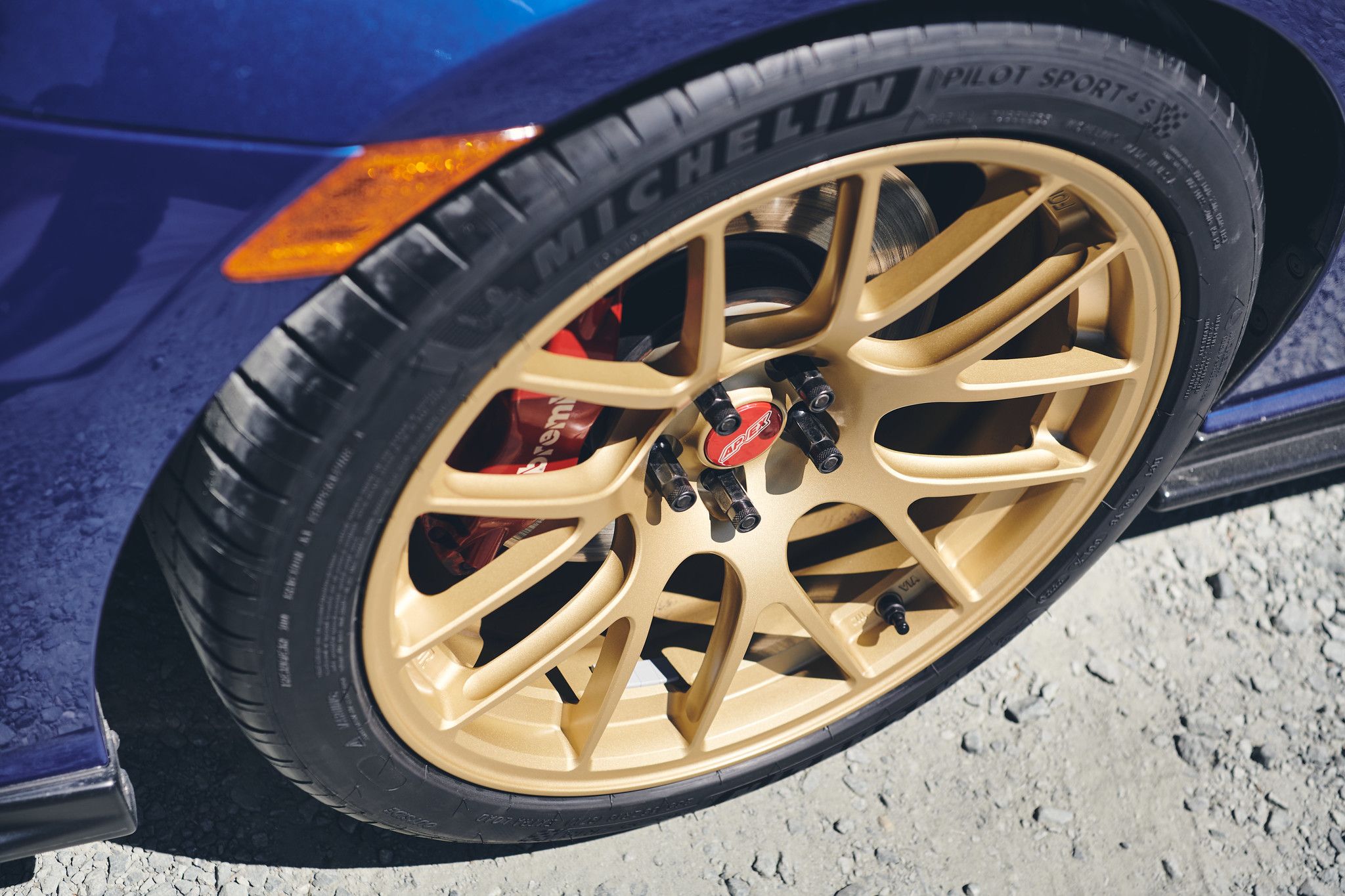 Blue Subaru ZC6 / Gen 1 BRZ with 17" EC-7R Apex wheels in Satin Gold