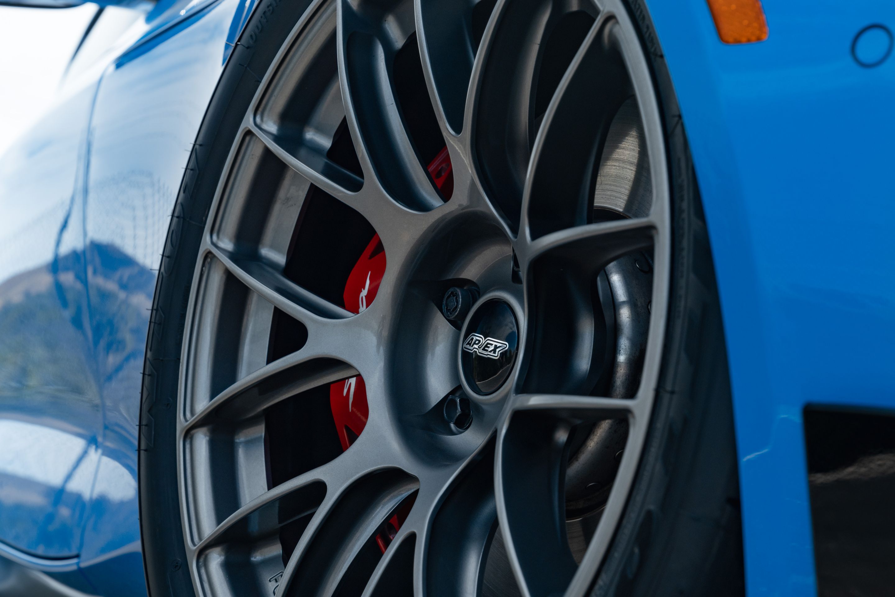 Blue Toyota GR Supra with 18" EC-7RS Apex wheels in Anthracite