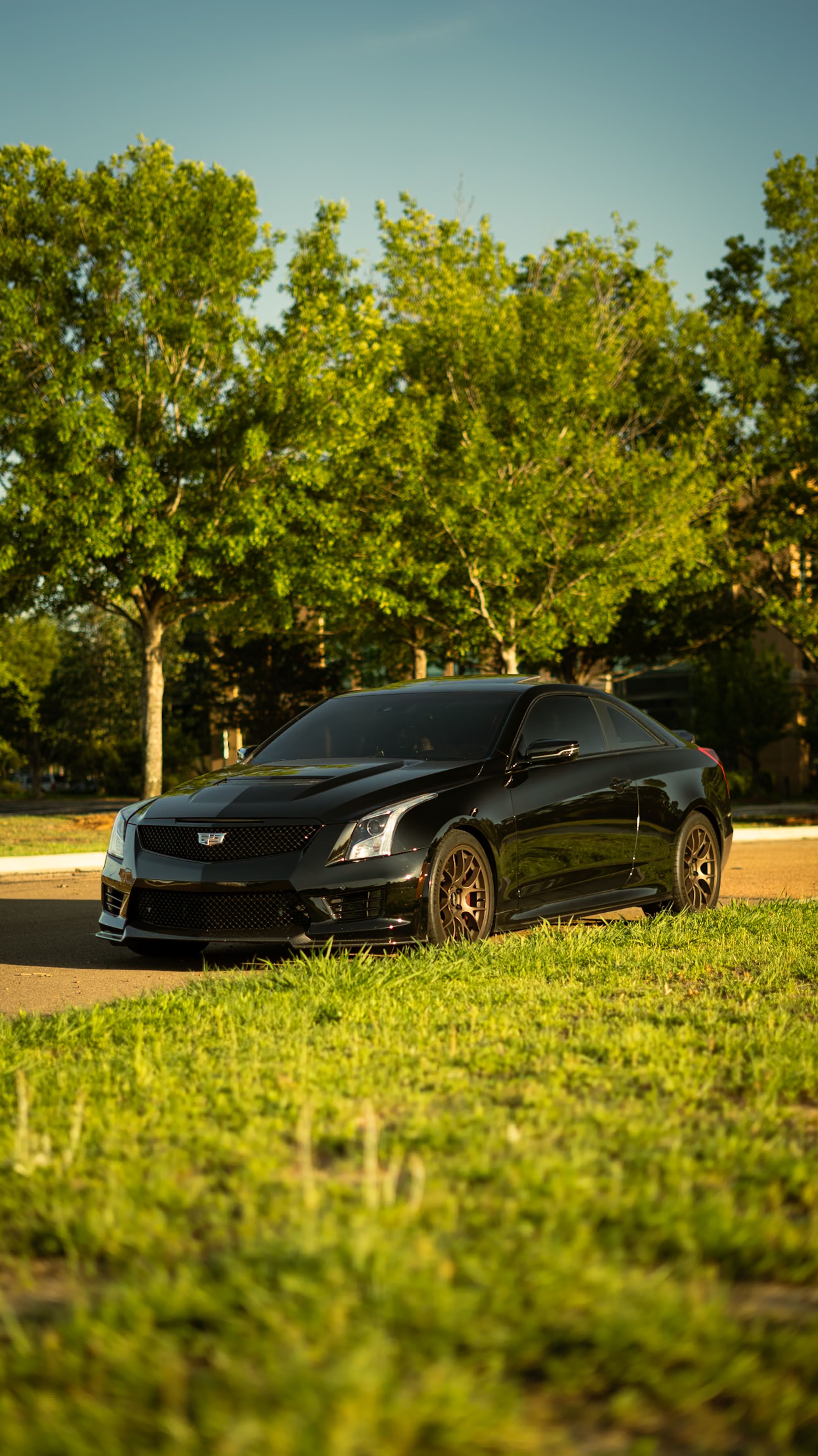 Black Cadillac ATS-V with 18" EC-7 Apex wheels in Satin Bronze