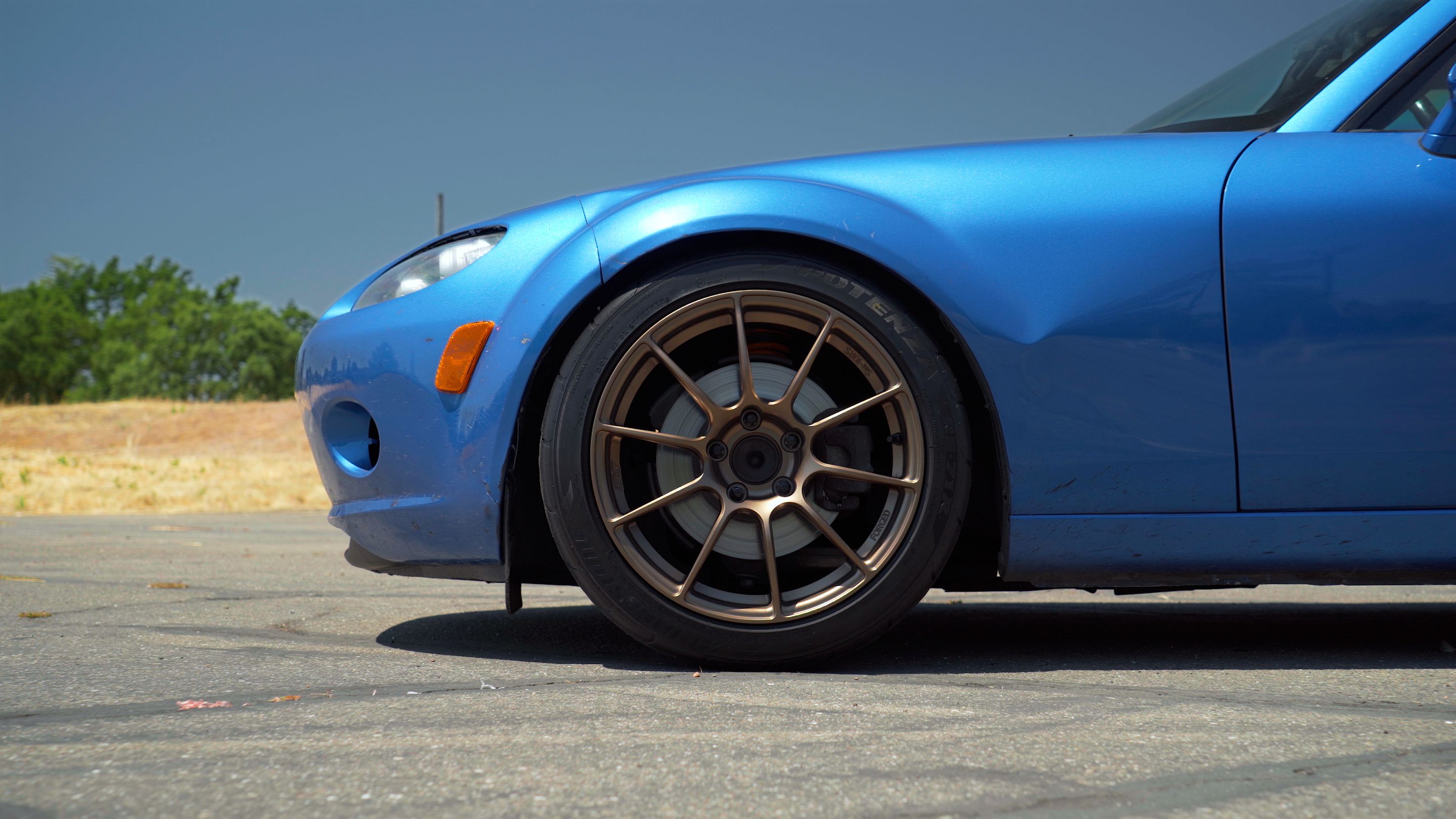 Blue Mazda NC MX-5 Miata with 17" SM-10RS Apex wheels in Satin Bronze