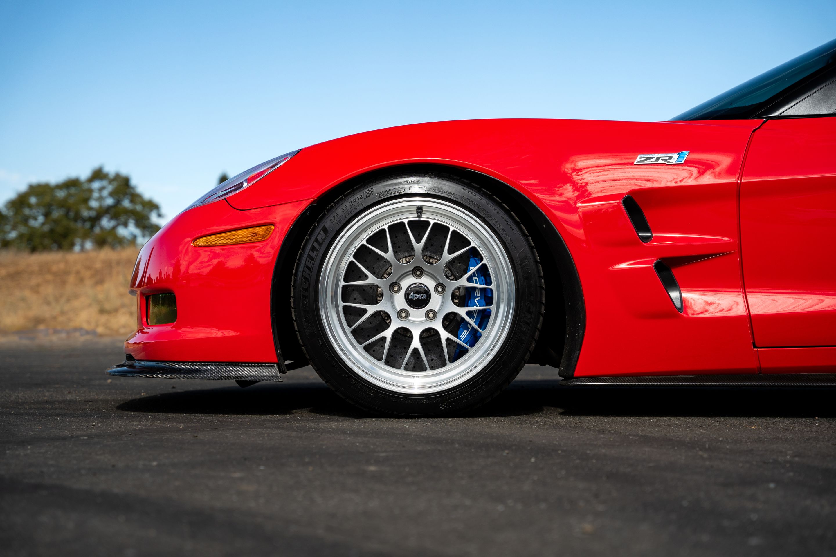 Red Chevrolet C6 Corvette ZR-1 with 18"/19" ML-10RT Apex wheels in Machined Lip Race Silver
