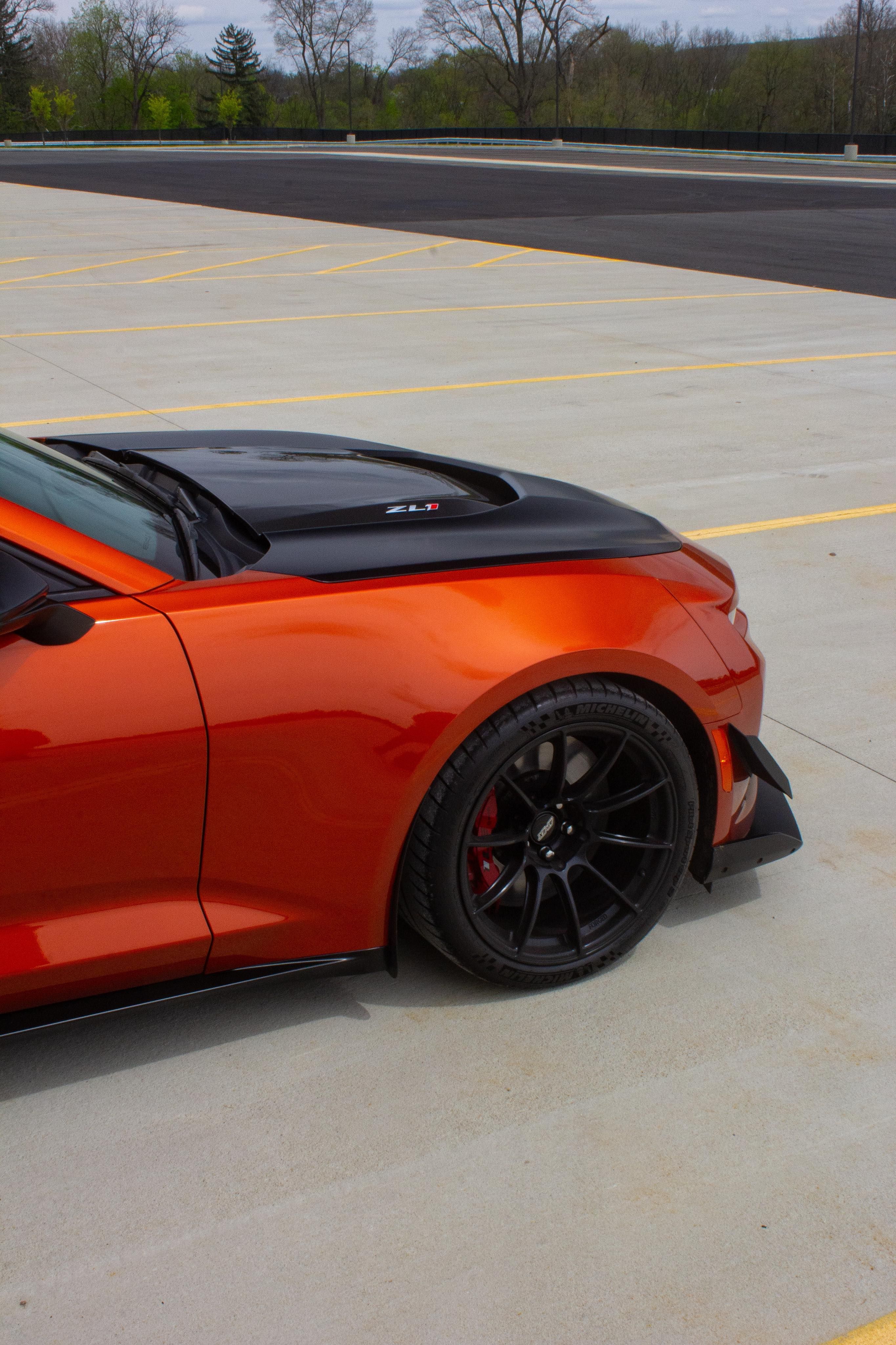 Red Chevrolet 6th Gen Camaro ZL1 1LE with 19" SM-10RS Apex wheels in Satin Black
