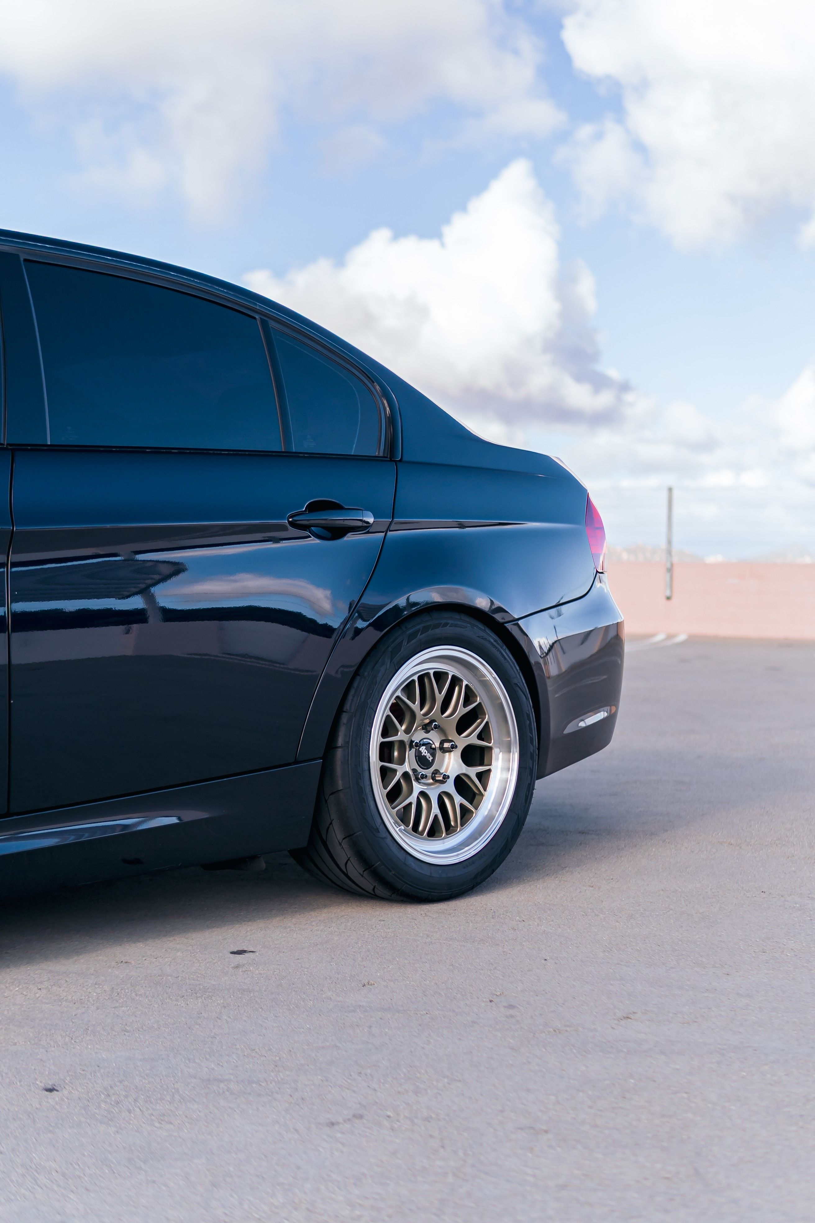 Black BMW E90 Sedan 3 Series with 17" ML-10RT Apex wheels in Machined Lip Gloss Motorsport Gold