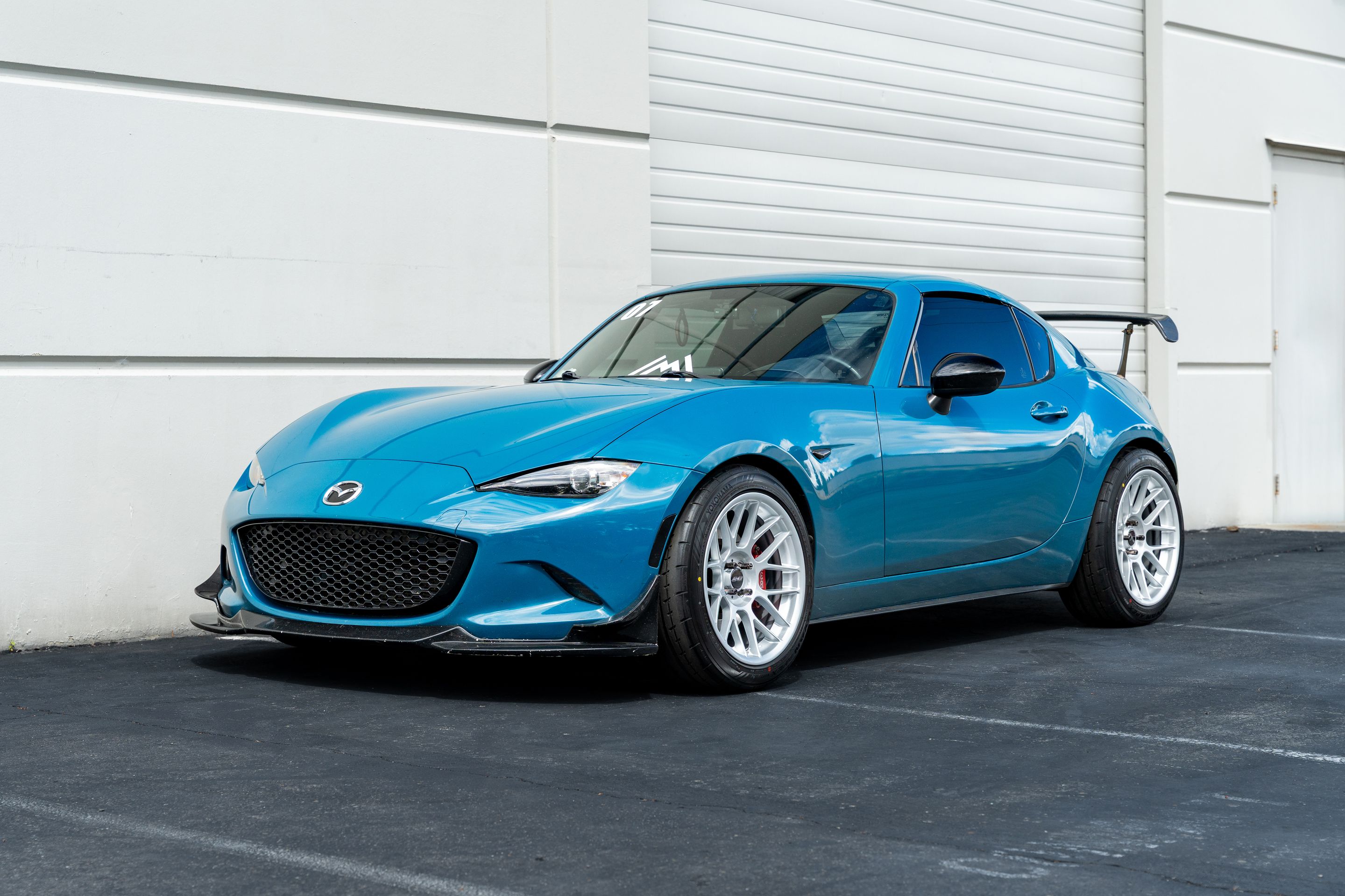 Blue Mazda ND MX-5 Miata with 17" ARC-8 Apex wheels in Race Silver