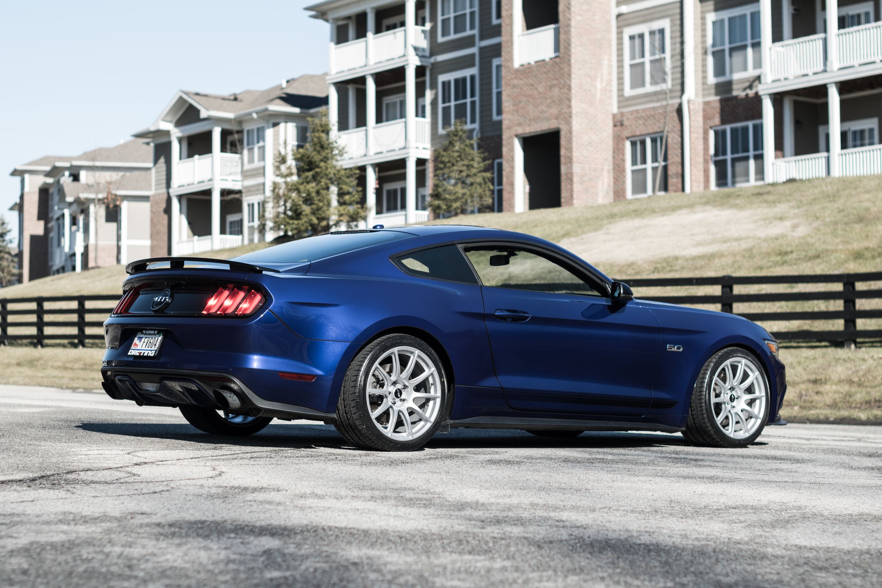 Blue Ford S550 Mustang GT with 19" SM-10 Apex wheels in Race Silver