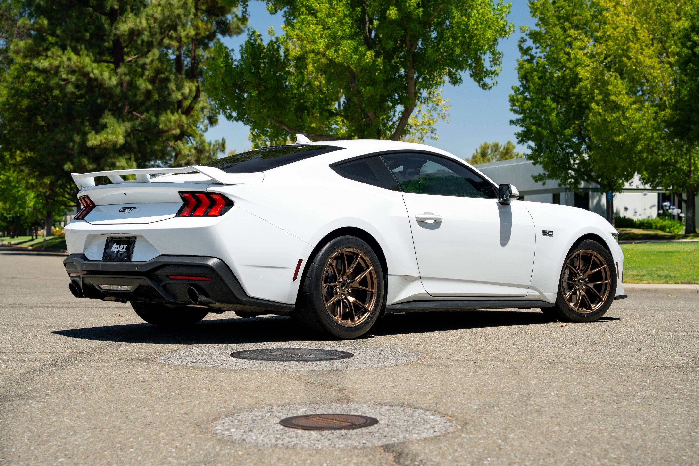 White Ford S650 Mustang GT with 18" VS-5RS Apex wheels in Satin Bronze