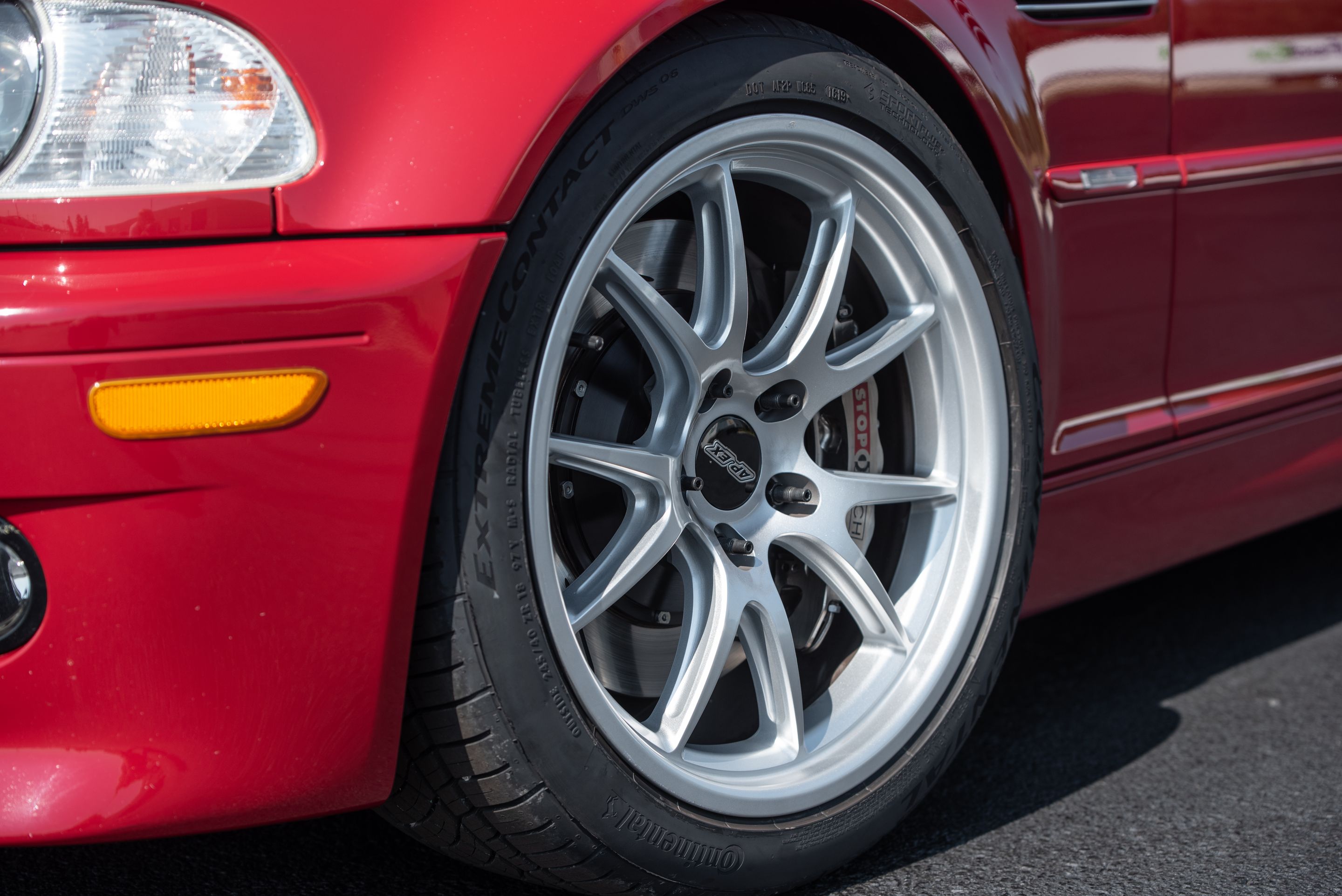 Red BMW E46 M3 with 18" FL-5 Apex wheels in Race Silver