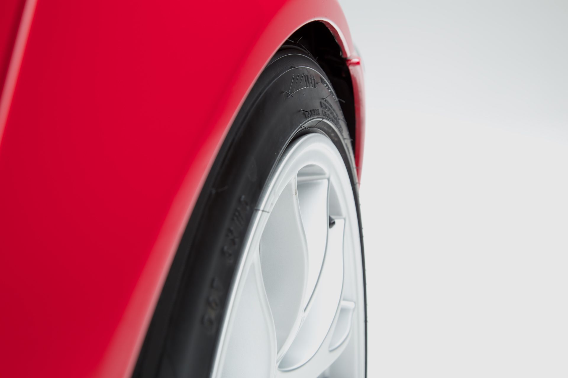 Red BMW E46 3 Series with 18" EC-7 Apex wheels in Race Silver