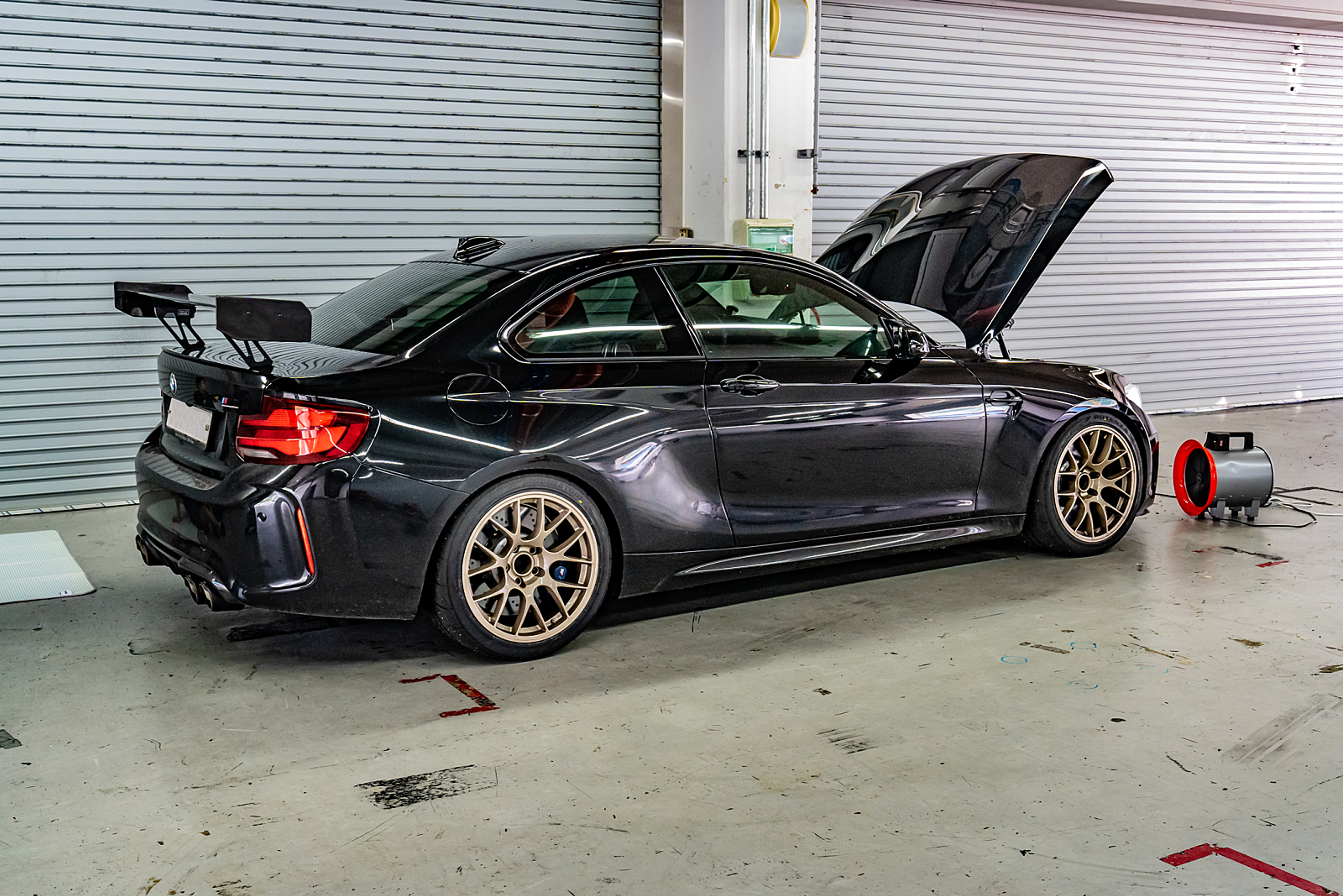 Black BMW F87 M2 with 18" EC-7 Apex wheels in Custom Finish
