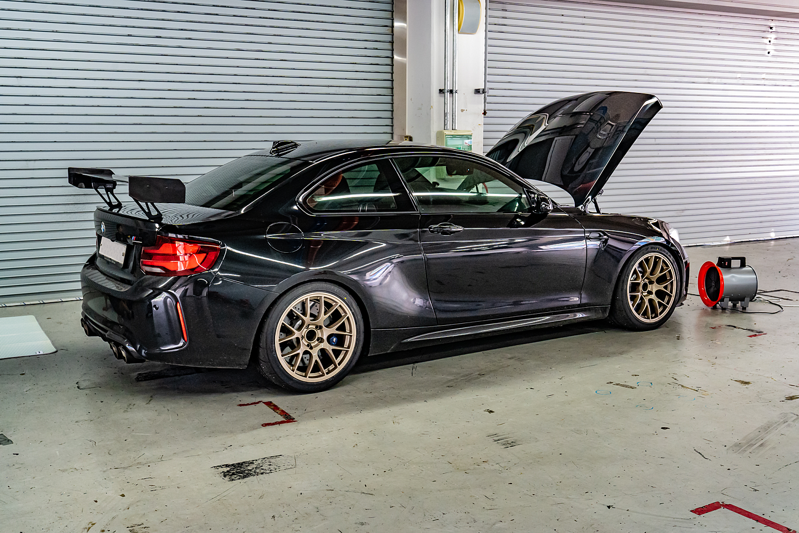 Black BMW F87 M2 with 18" EC-7 Apex wheels in Custom Finish
