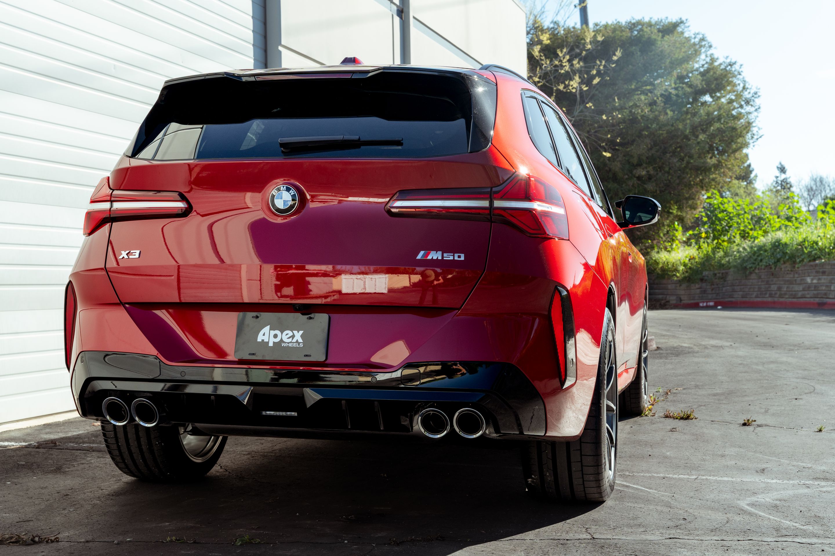 Red BMW G45 X3 with 20" VS-5RX Apex wheels in Anthracite