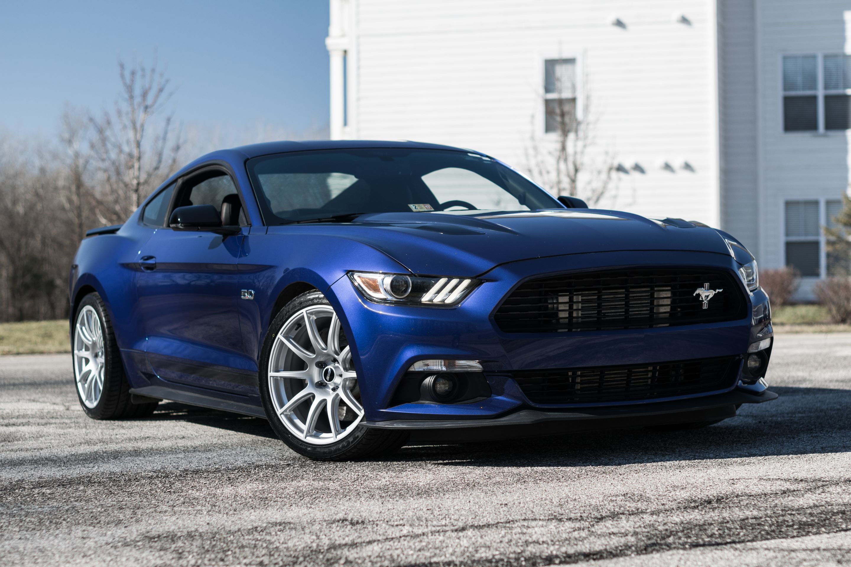 Blue Ford S550 Mustang GT with 19" SM-10 Apex wheels in Race Silver