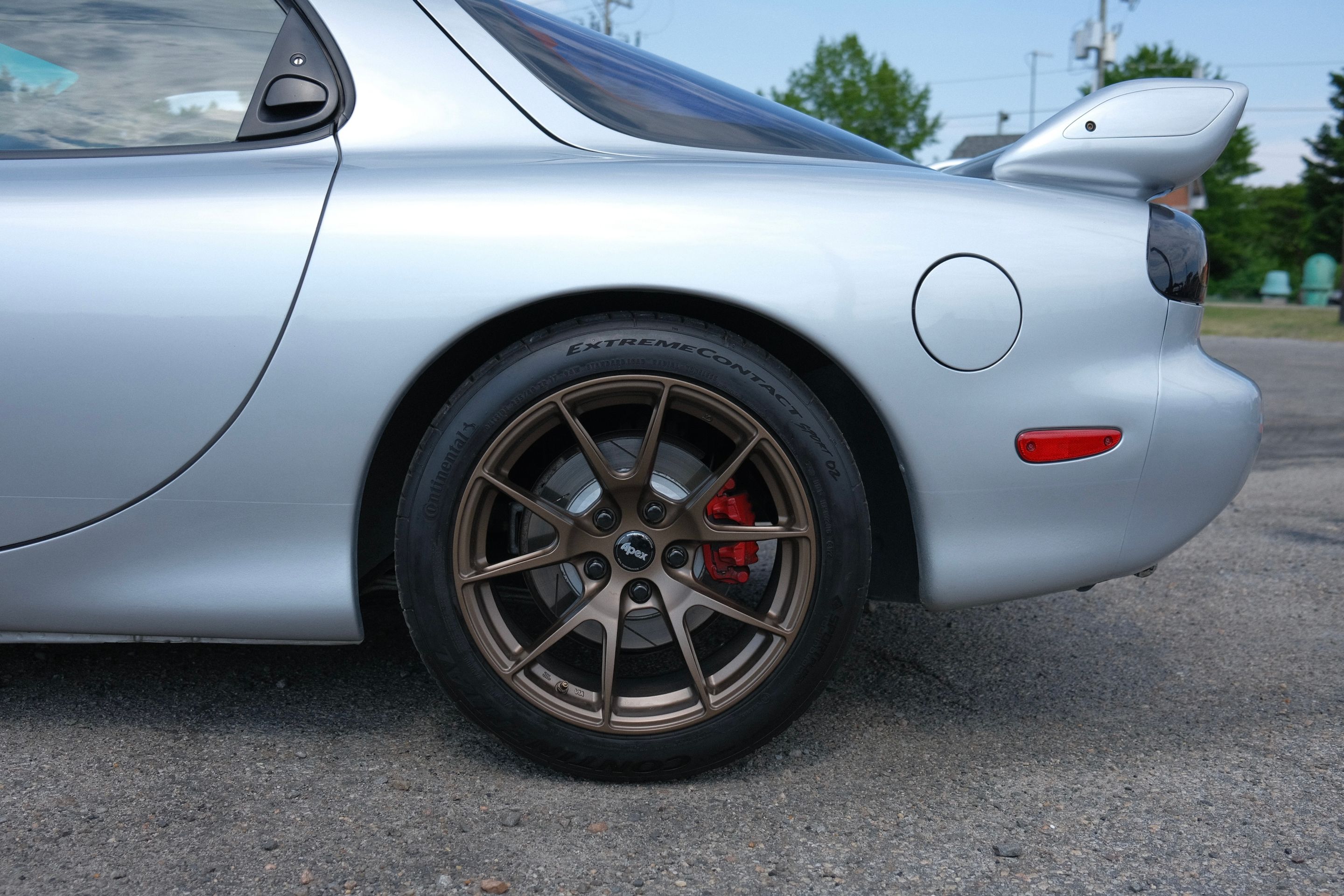 Silver Mazda FD RX-7 with 17" VS-5 Apex wheels in Satin Bronze