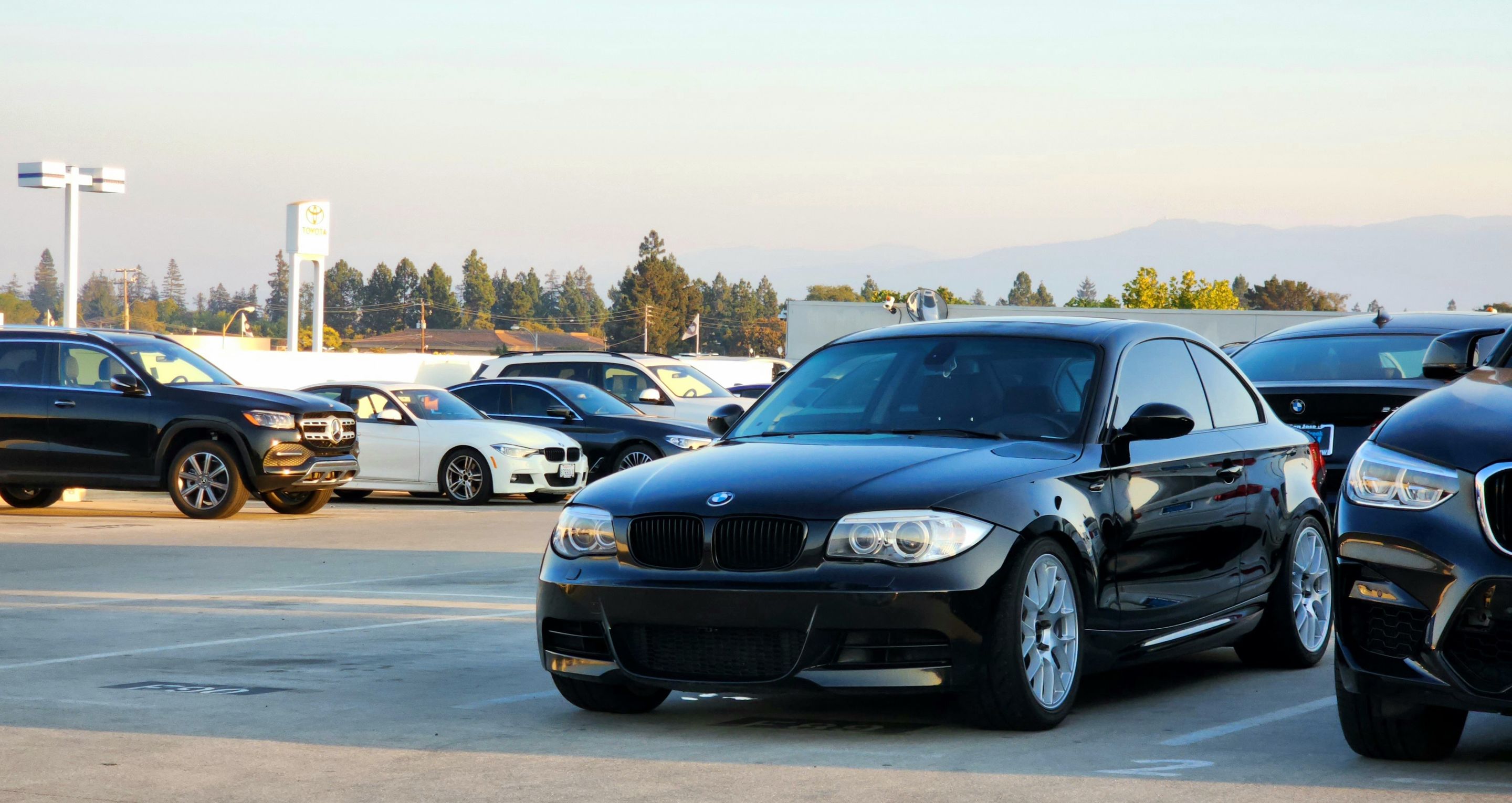 Black BMW E82 Coupe 1 Series with 18" EC-7 Apex wheels in Race Silver