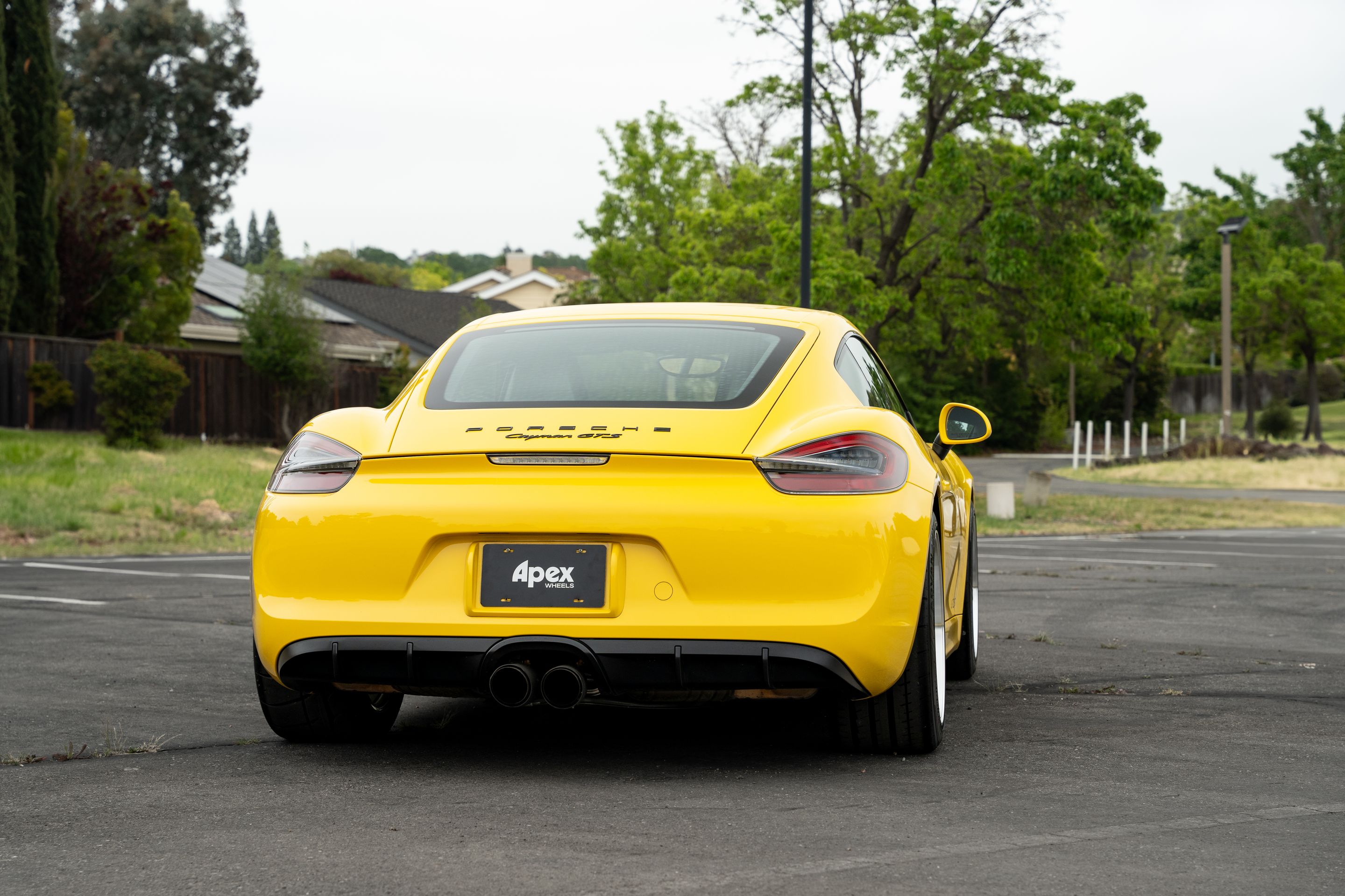 Yellow Porsche 981 Cayman GTS with 19" ML-10RT Apex wheels in Machined Lip Race Silver