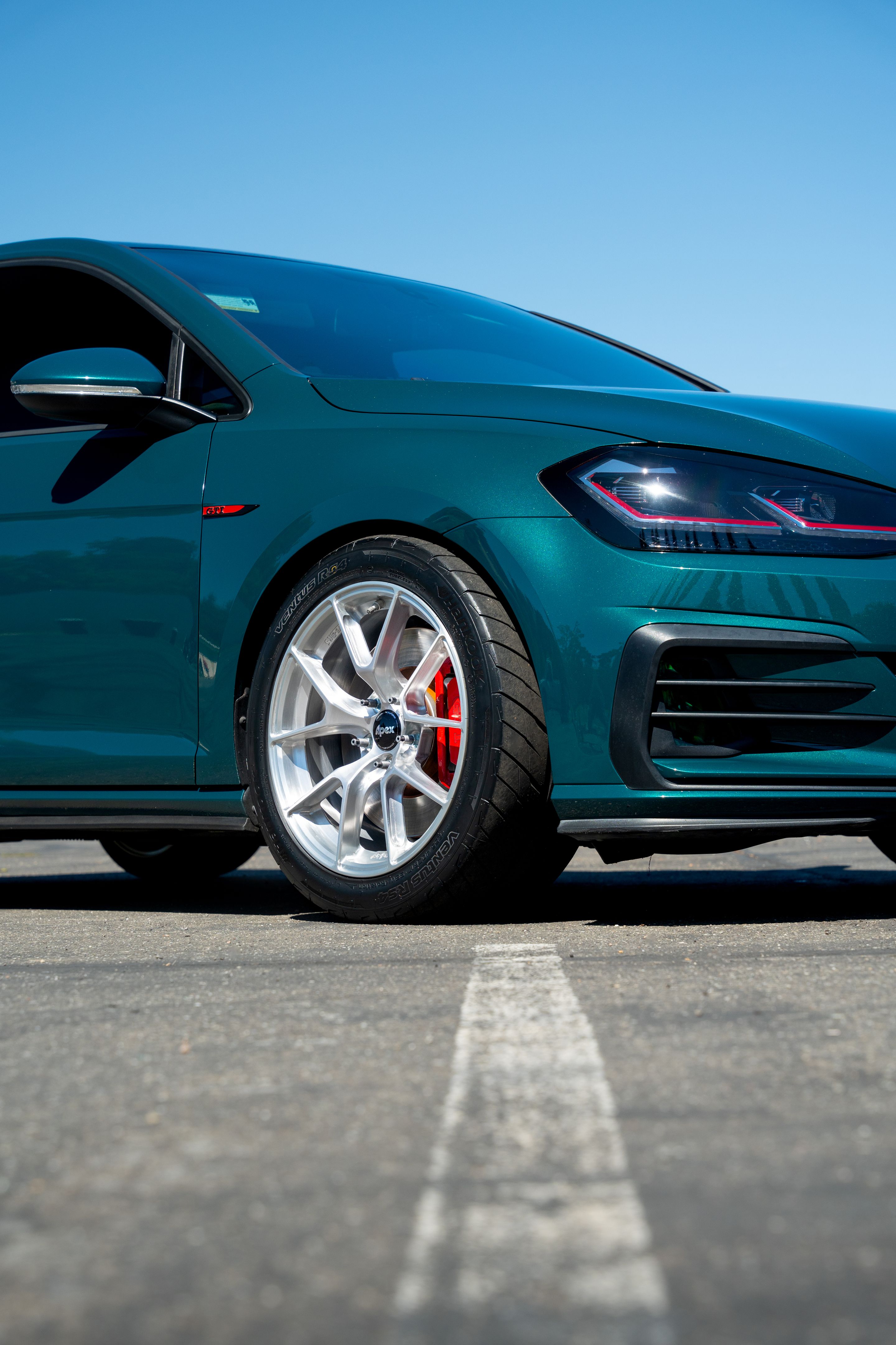 Green VW MK7 GTI with 17" VS-5RS Apex wheels in Brushed Clear