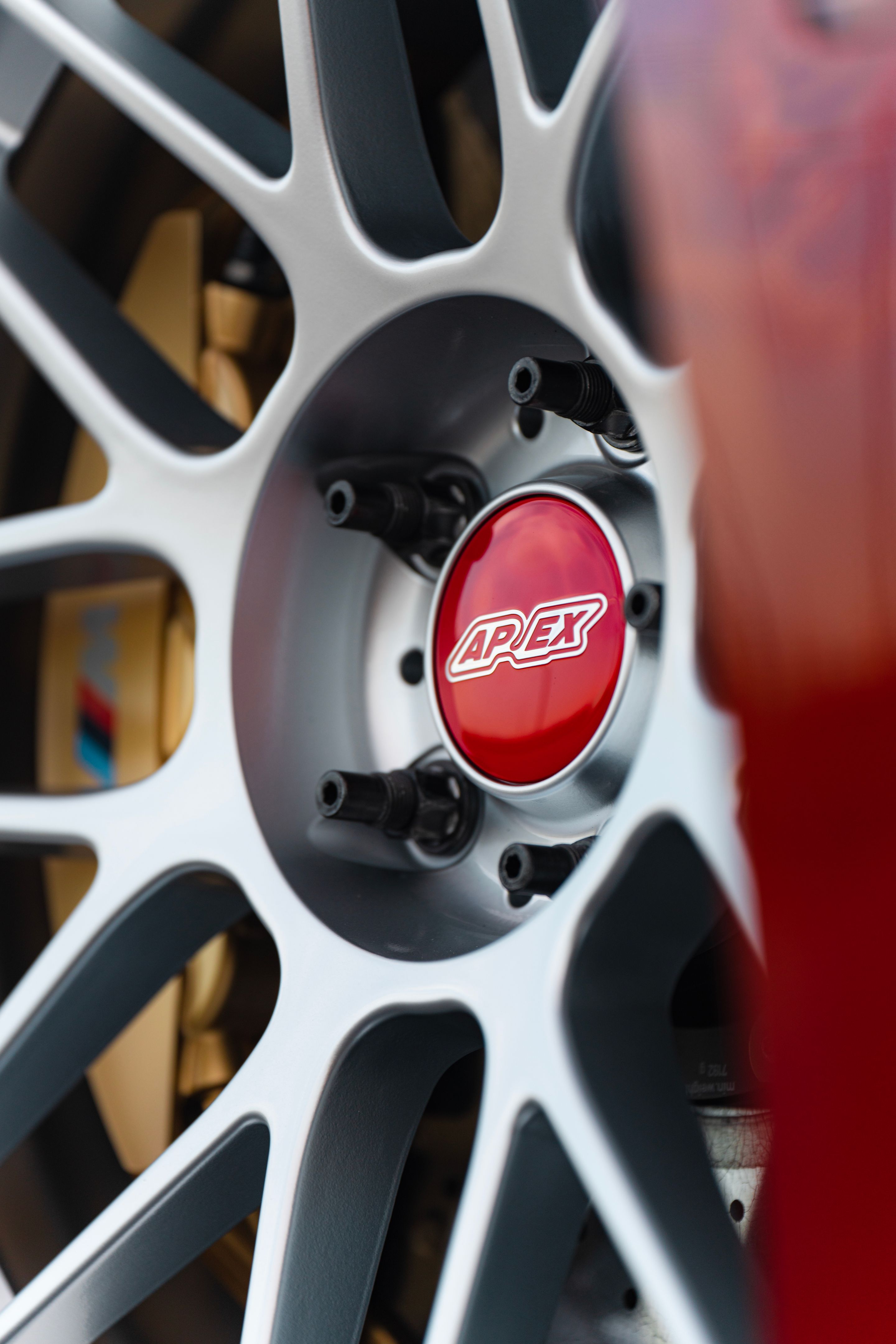 Red BMW F82 Coupe M4 with 19" ARC-8 Apex wheels in Hyper Silver