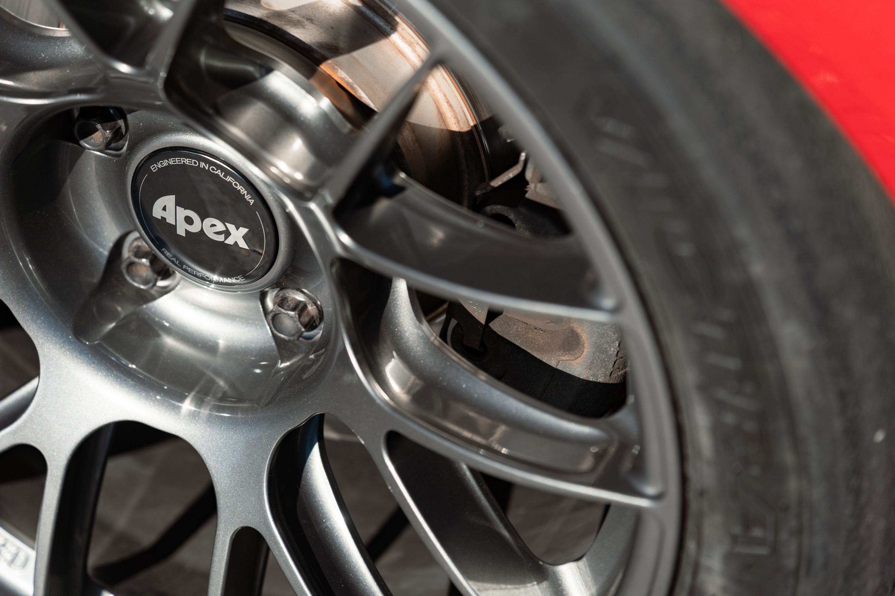 Red BMW E46 M3 with 18" EC-7RS Apex wheels in Anthracite