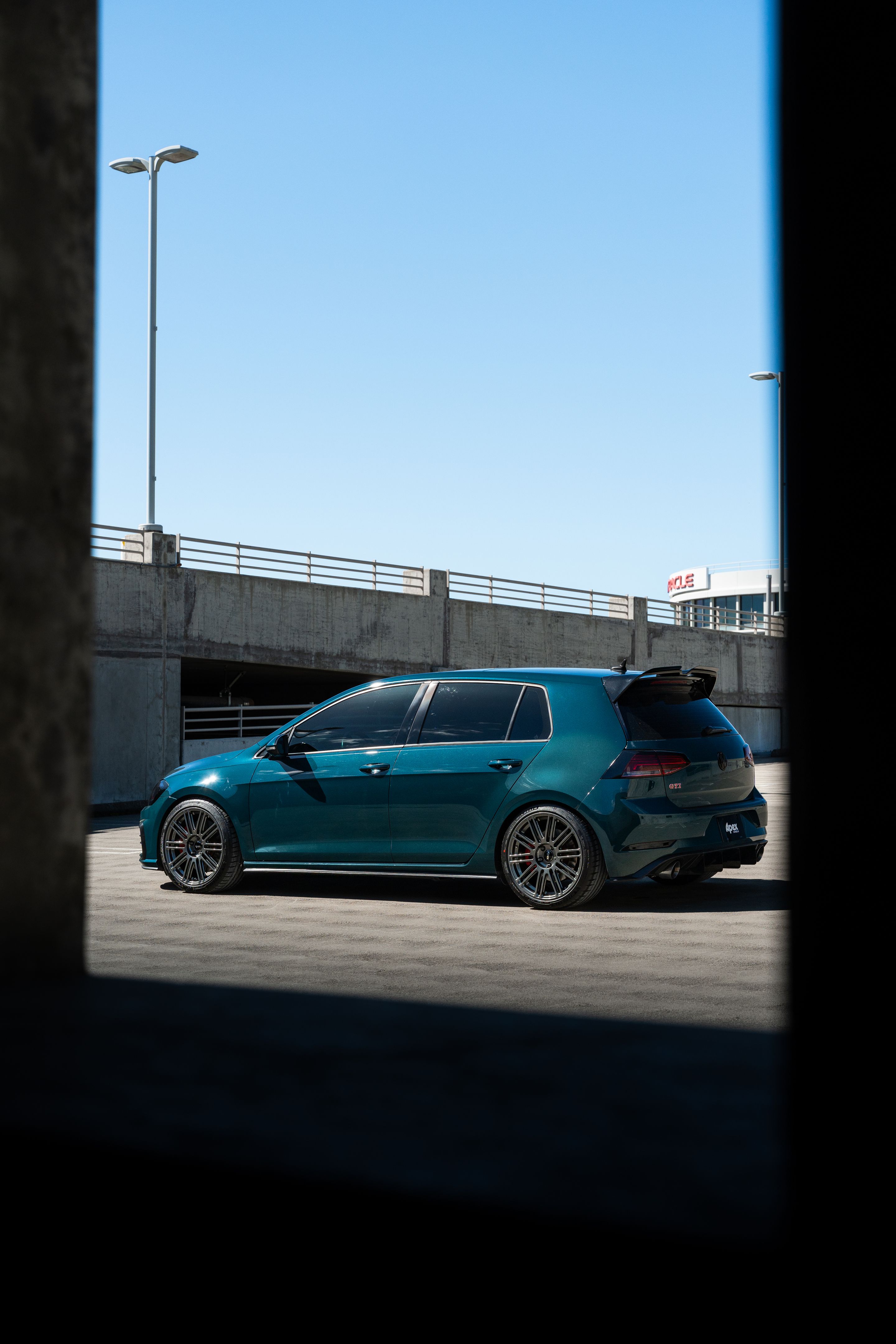Green VW MK7 GTI with 18" TC-10RT Apex wheels in Anthracite