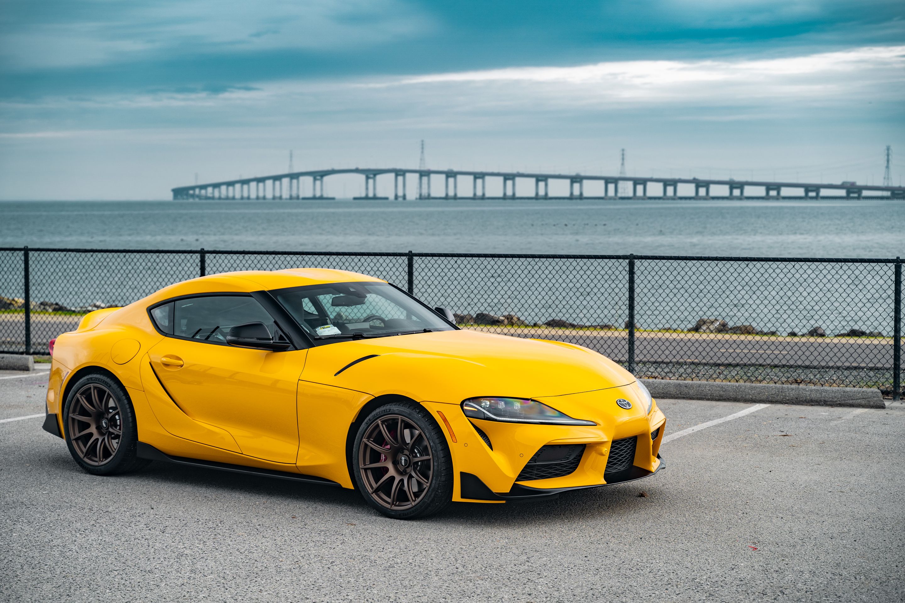Yellow Toyota GR Supra with 19" SM-10 Apex wheels in Satin Bronze