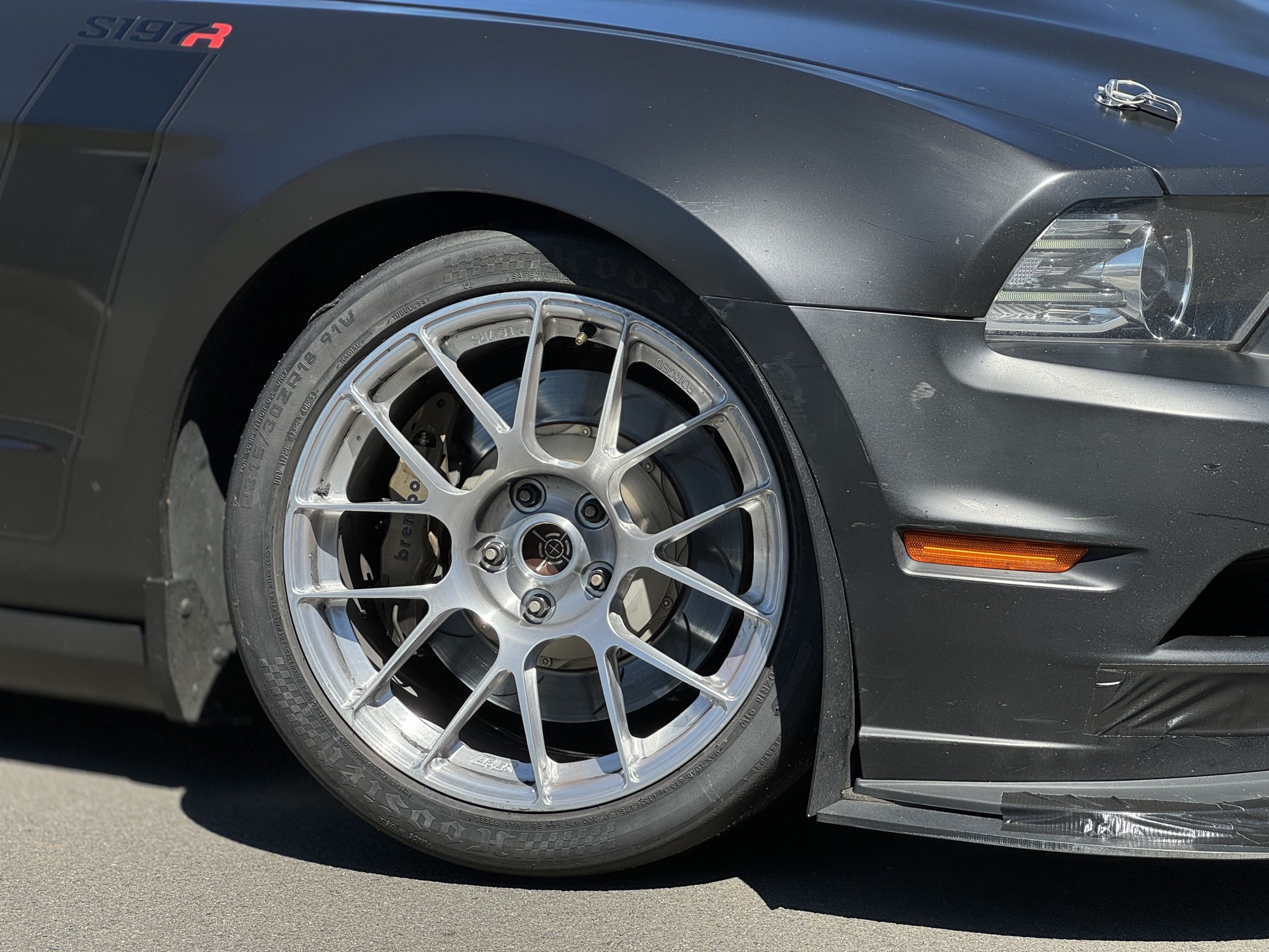 Black Ford S197 Mustang GT with 18" EC-7RS Apex wheels in Brushed Clear