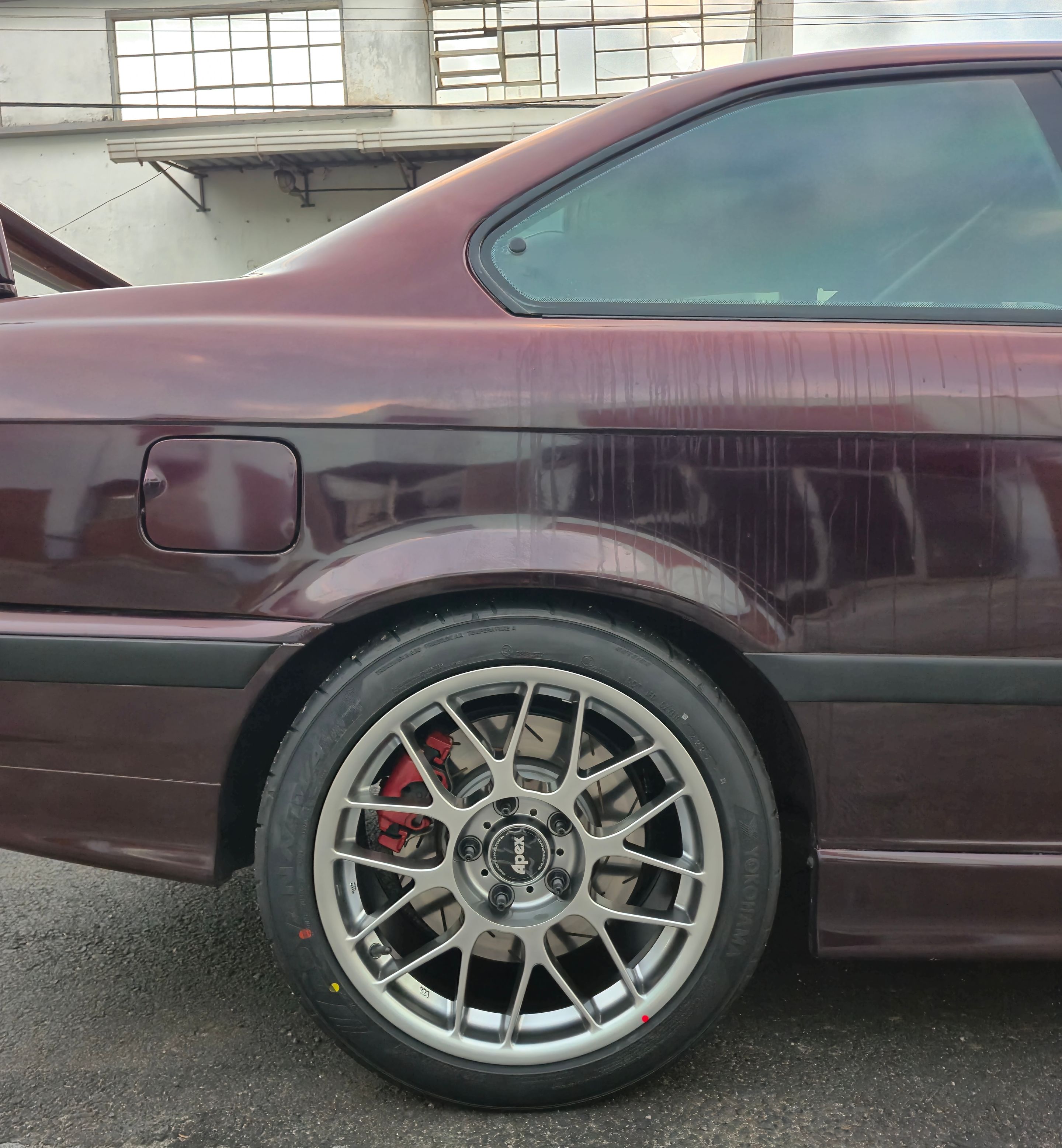 Red BMW E36 3 Series with 17" ARC-8 Apex wheels in Hyper Black