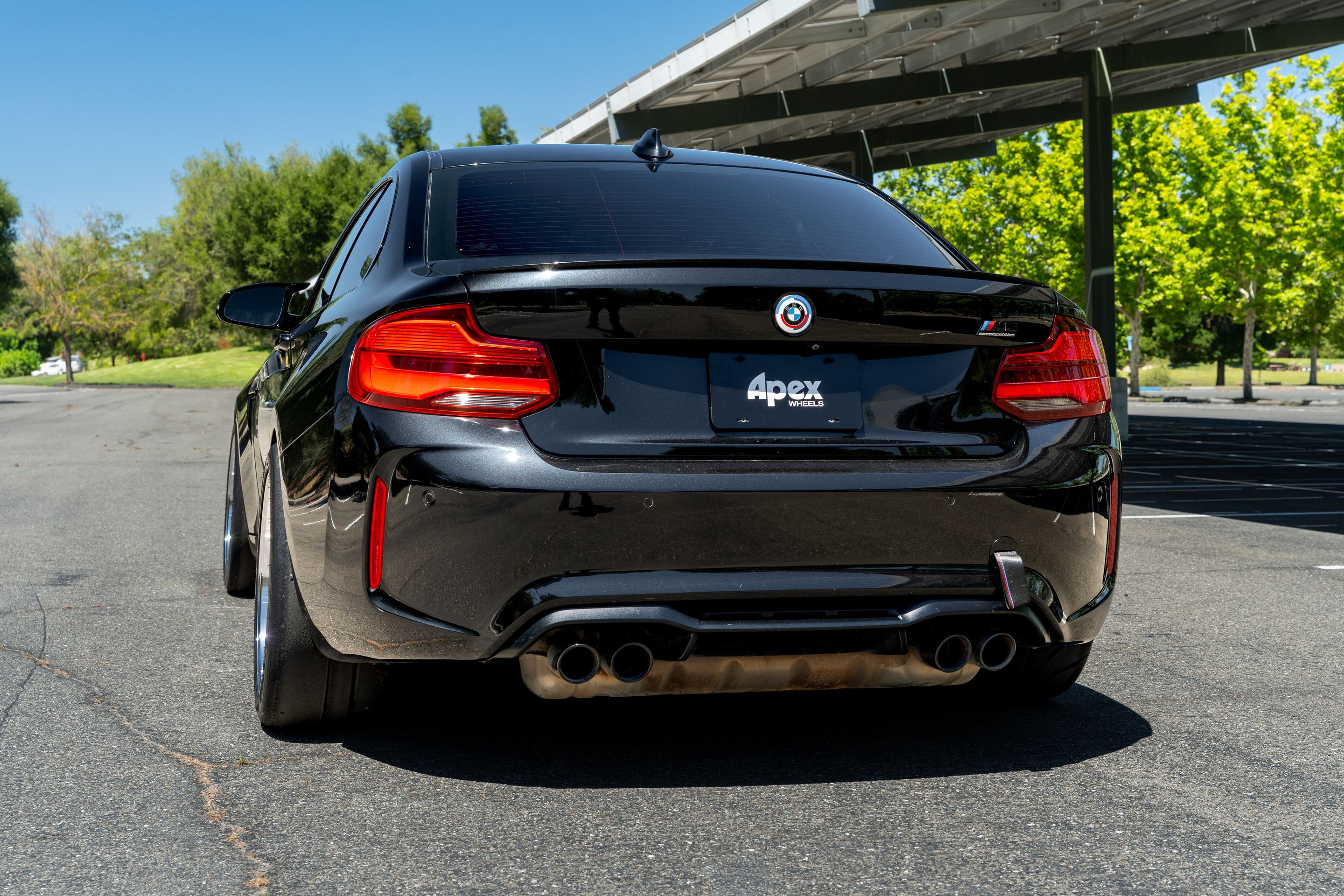 Black BMW F87 M2 with 18" SL-12RT Apex wheels in Machined Lip Race Silver