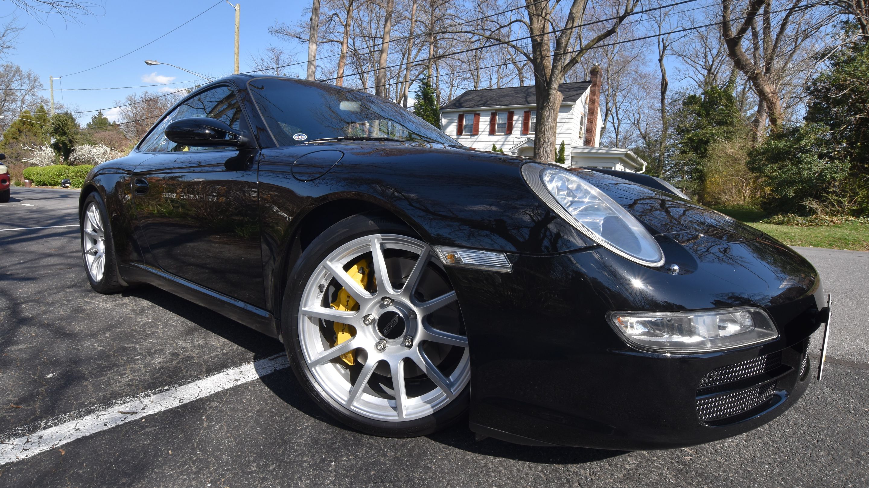 Black Porsche 911 997 Carrera S with 18" SM-10 Apex wheels in Race Silver