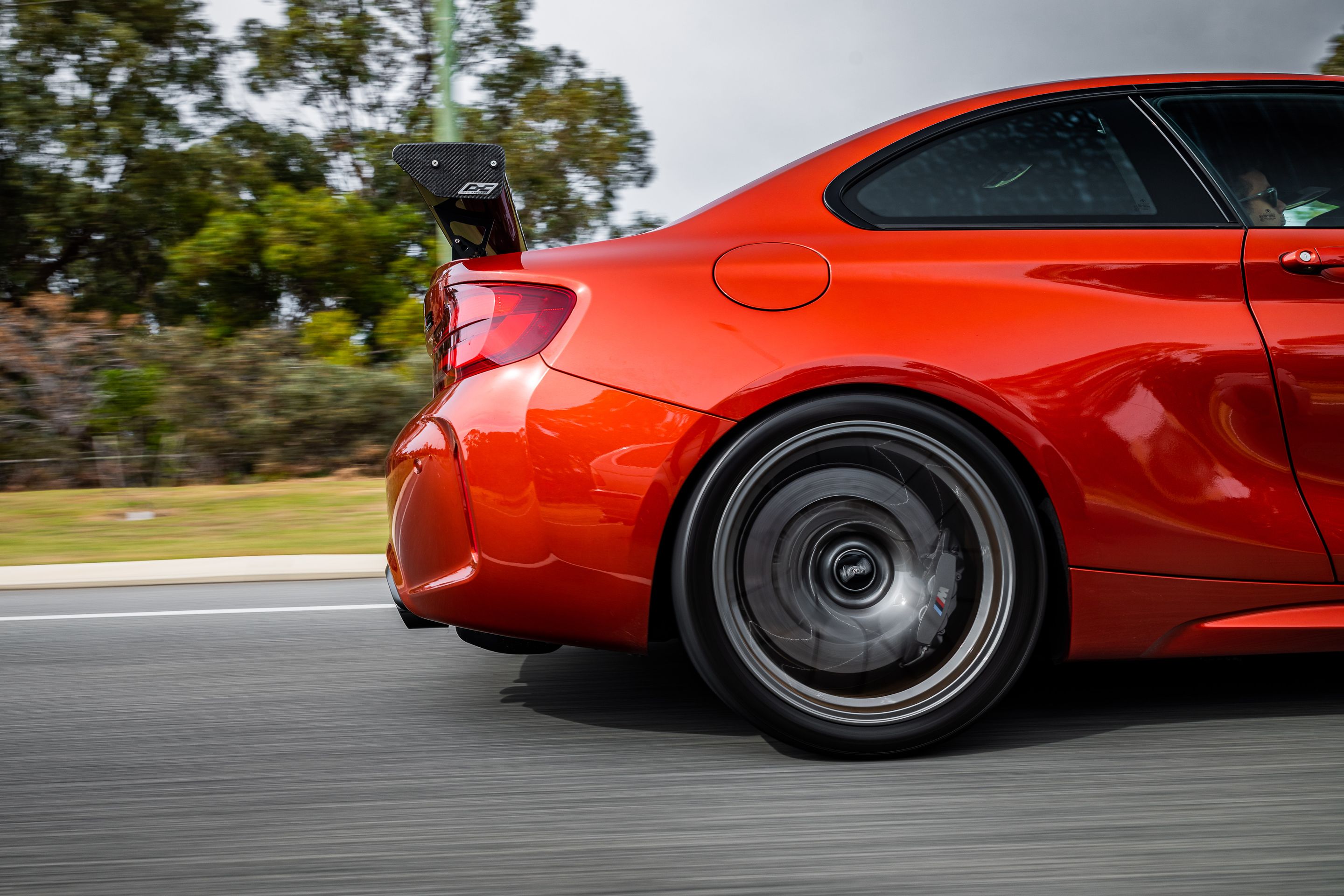 Orange BMW F87 M2 with 19" EC-7 Apex wheels in Anthracite