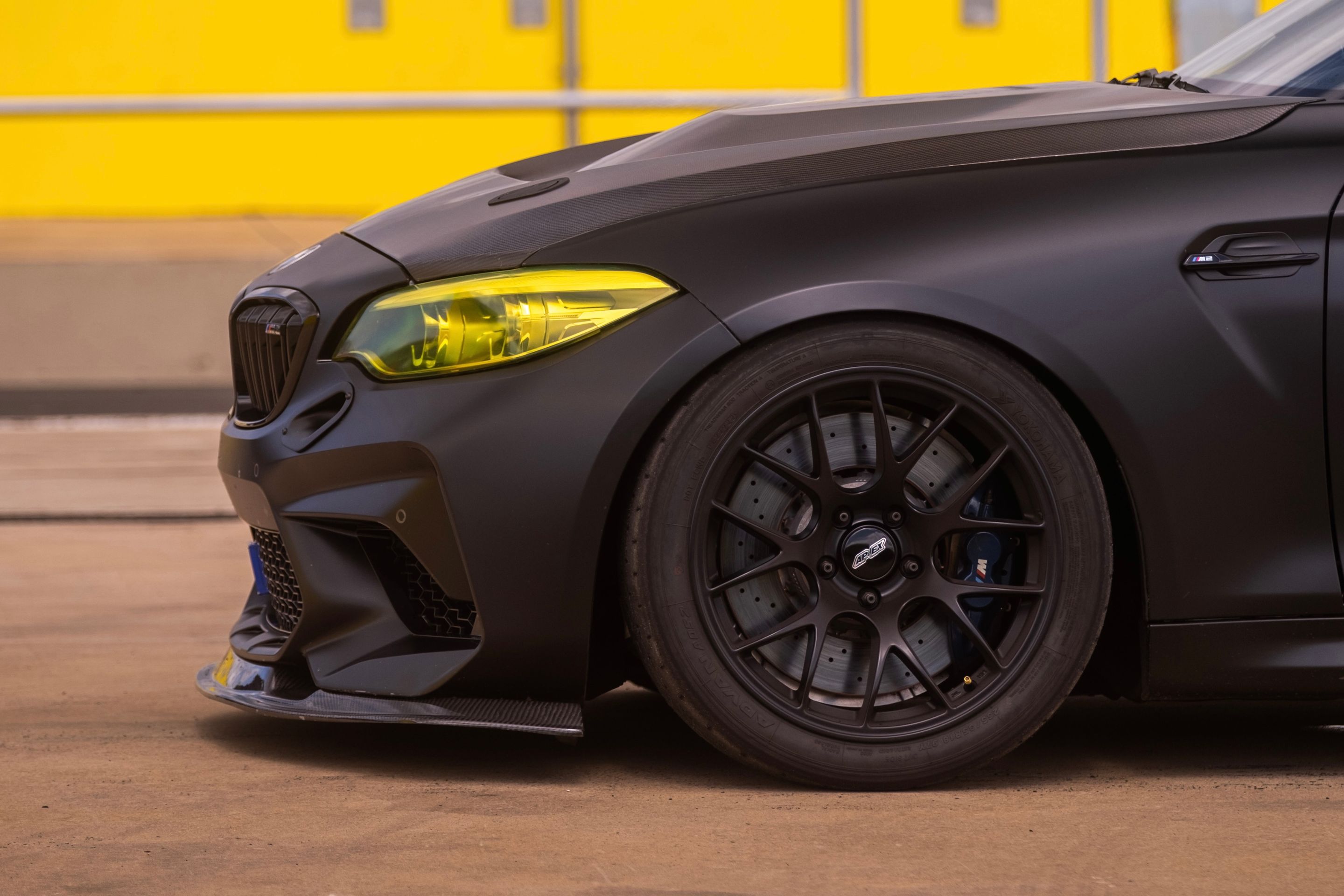 Black BMW F87 M2 with 18" EC-7 Apex wheels in Satin Black