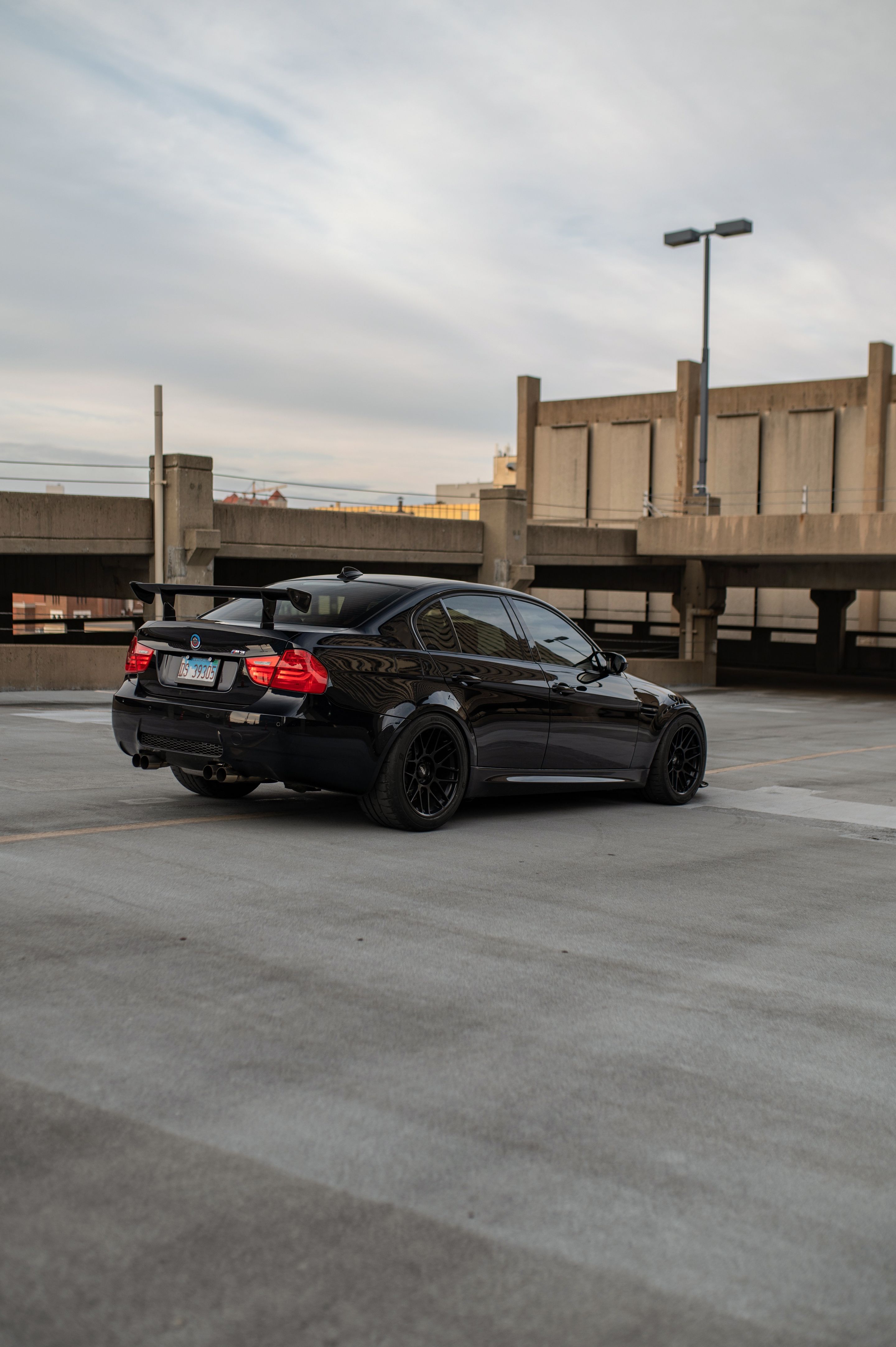 Black BMW E90 Sedan M3 with 18" ARC-8 Apex wheels in Satin Black