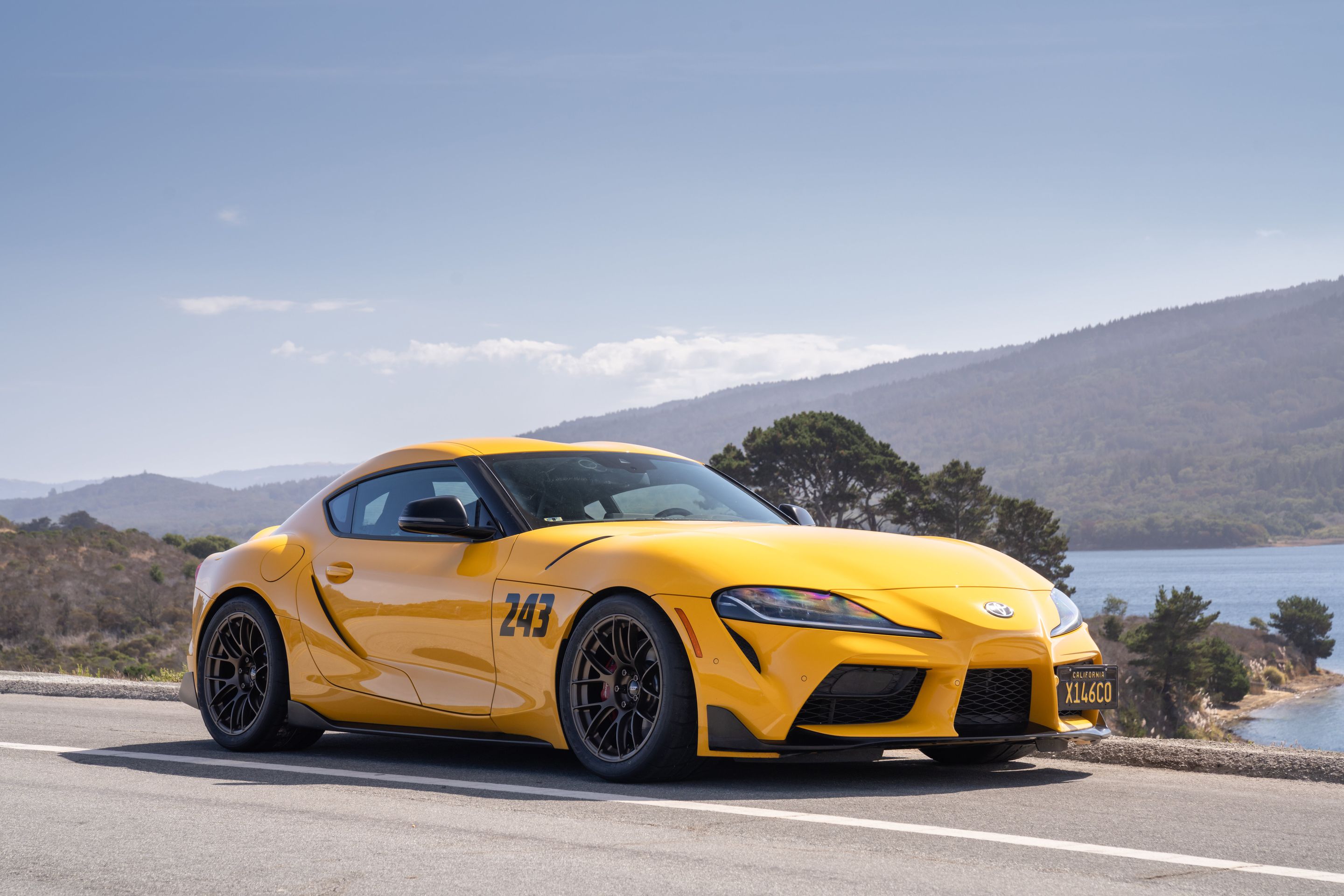 Yellow Toyota GR Supra with 18" EC-7RS Apex wheels in Satin Bronze