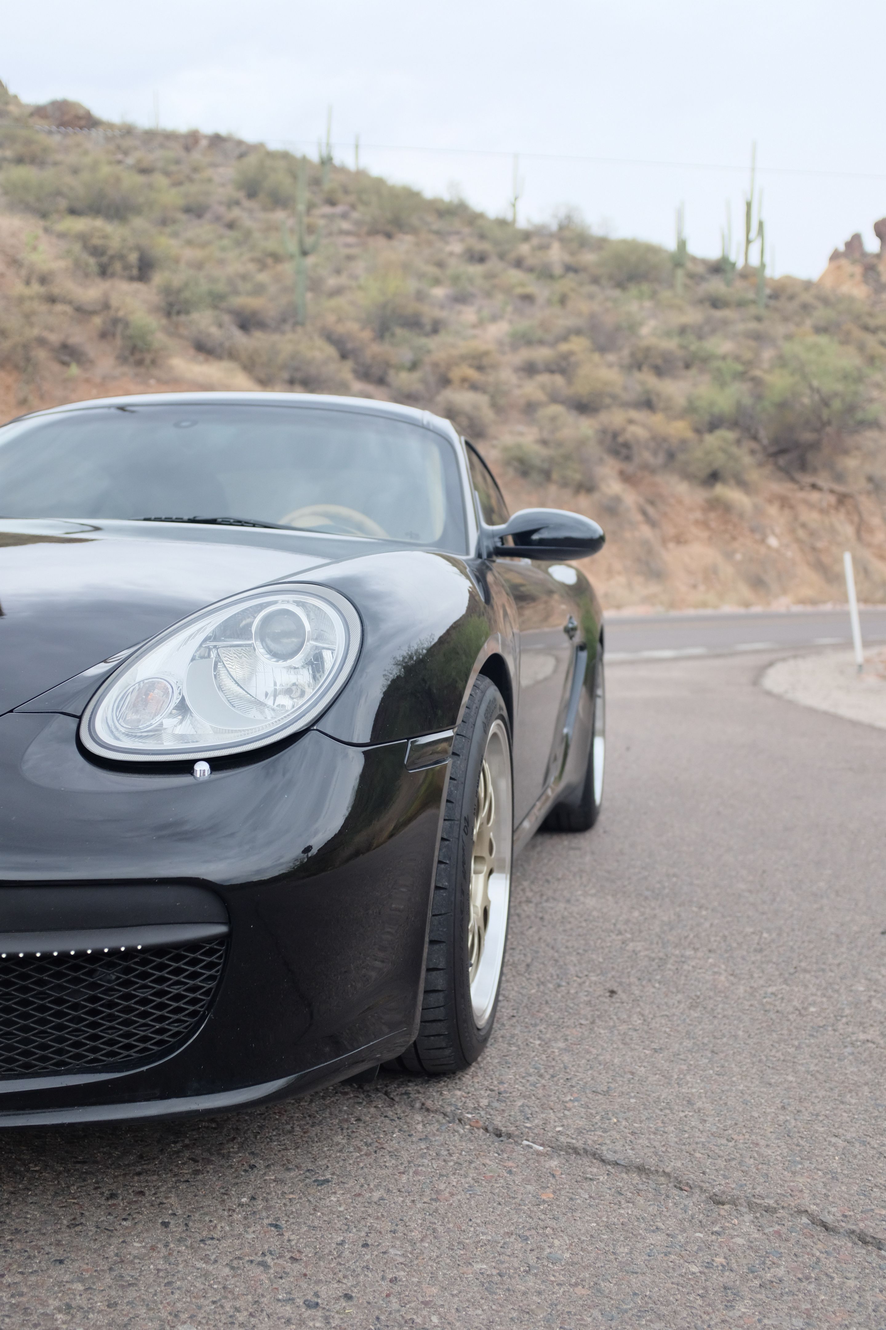 Black Porsche 987 Cayman S with 18" ML-10RT Apex wheels in Machined Lip Gloss Motorsport Gold