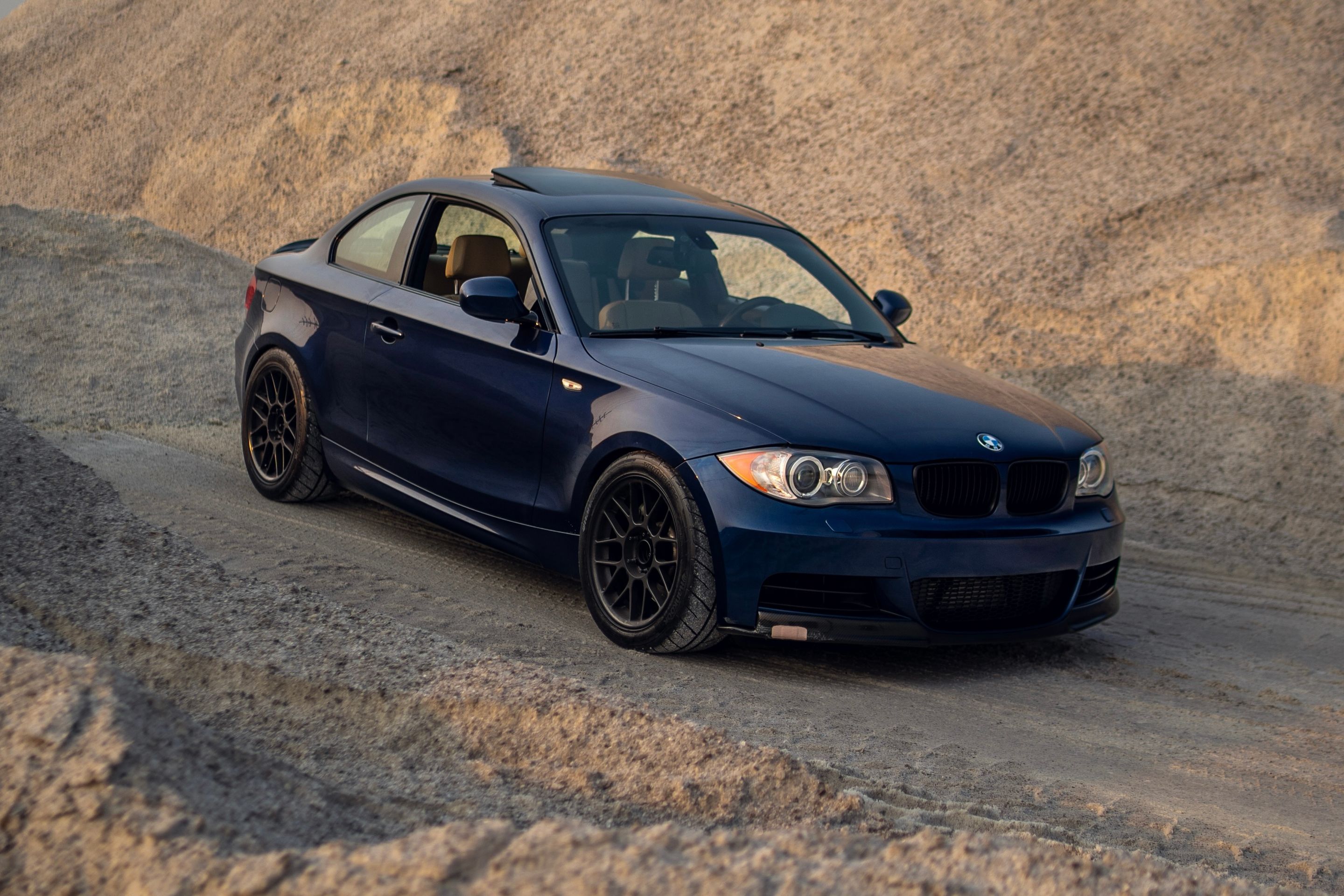 Blue BMW E82 Coupe 1 Series with 17" ARC-8 Apex wheels in Satin Black