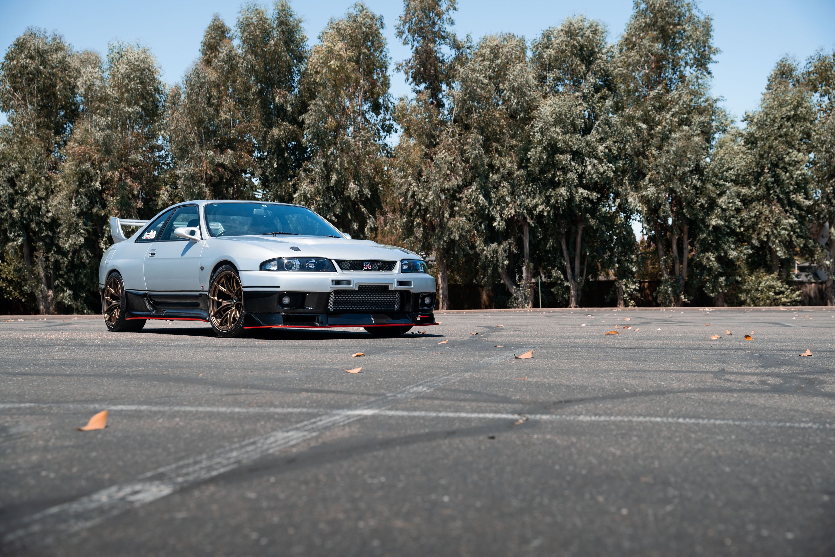 Silver Nissan R33 GT-R with 18" VS-5RS Apex wheels in Satin Bronze