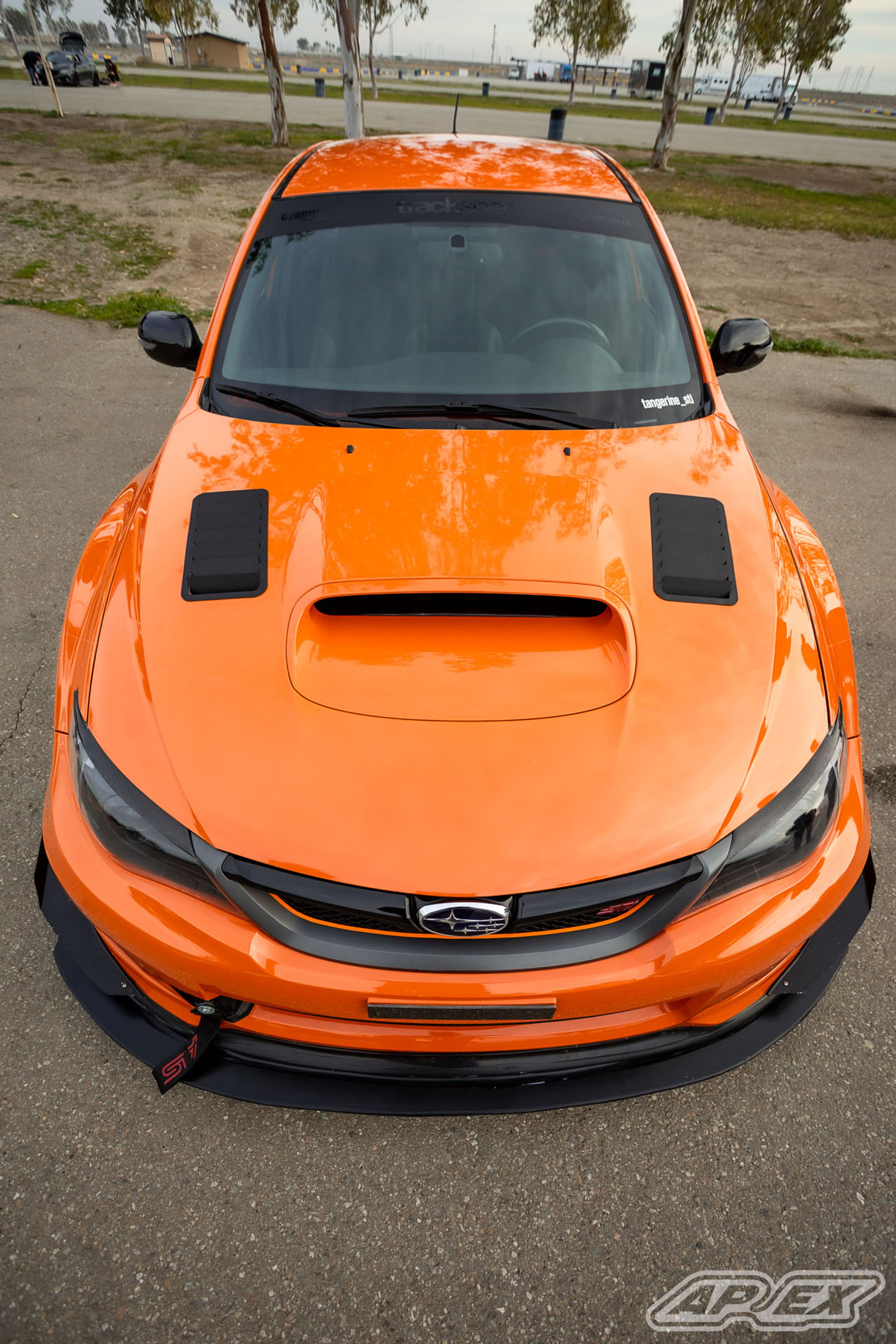 Orange Subaru GR WRX STI with 18" EC-7 Apex wheels in Satin Black