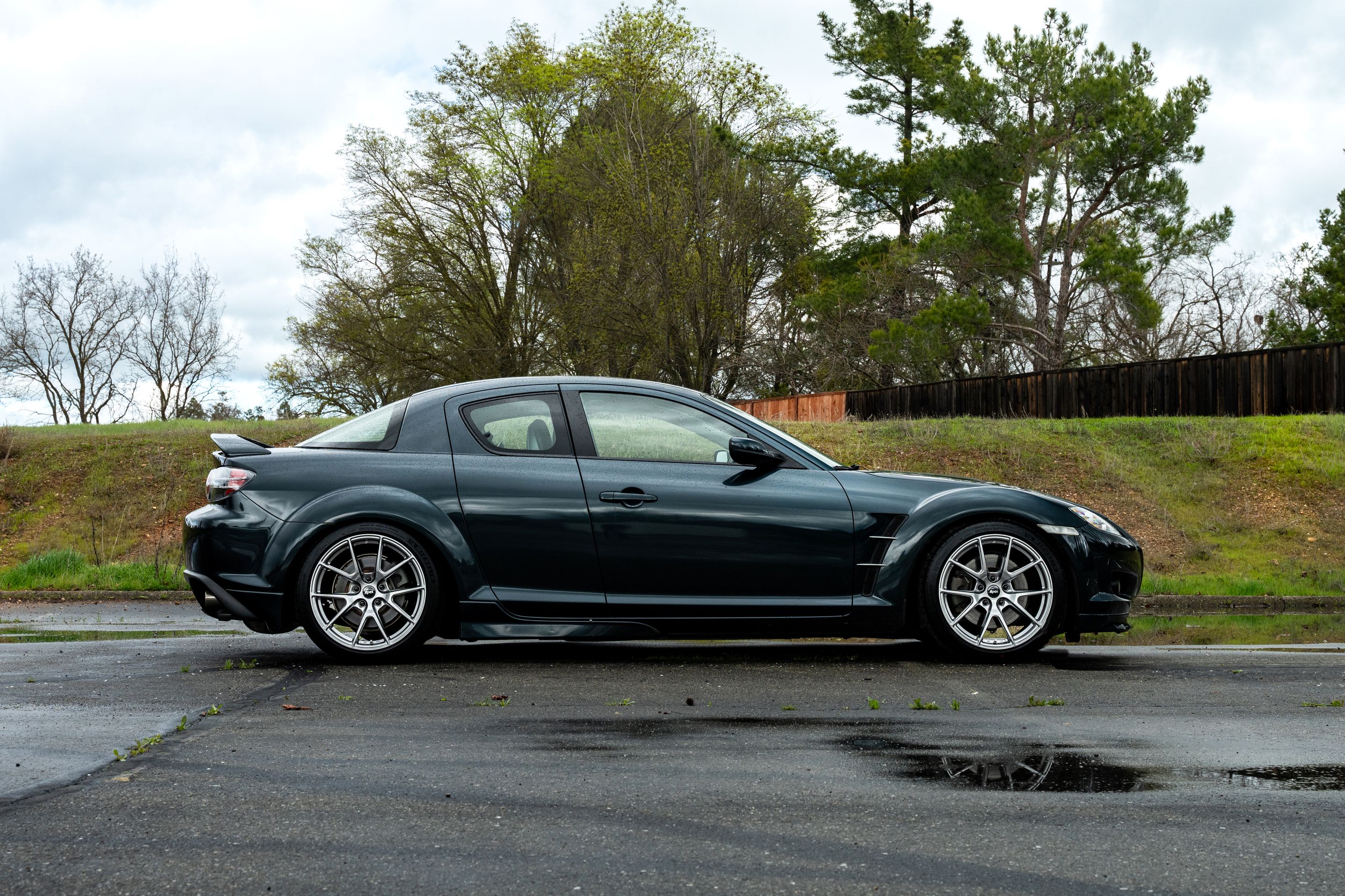 Green Mazda RX-8 with 18" VS-5 Apex wheels in Hyper Black