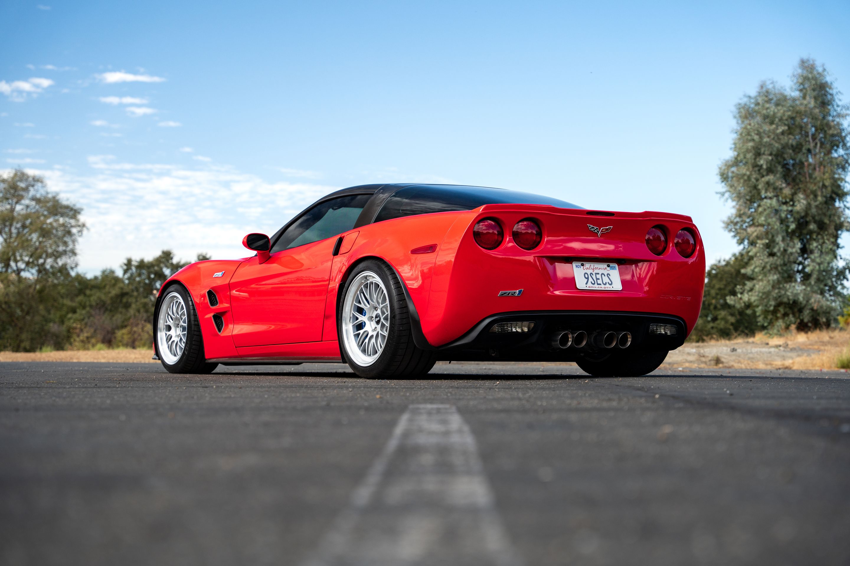 Red Chevrolet C6 Corvette ZR-1 with 18"/19" ML-10RT Apex wheels in Machined Lip Race Silver