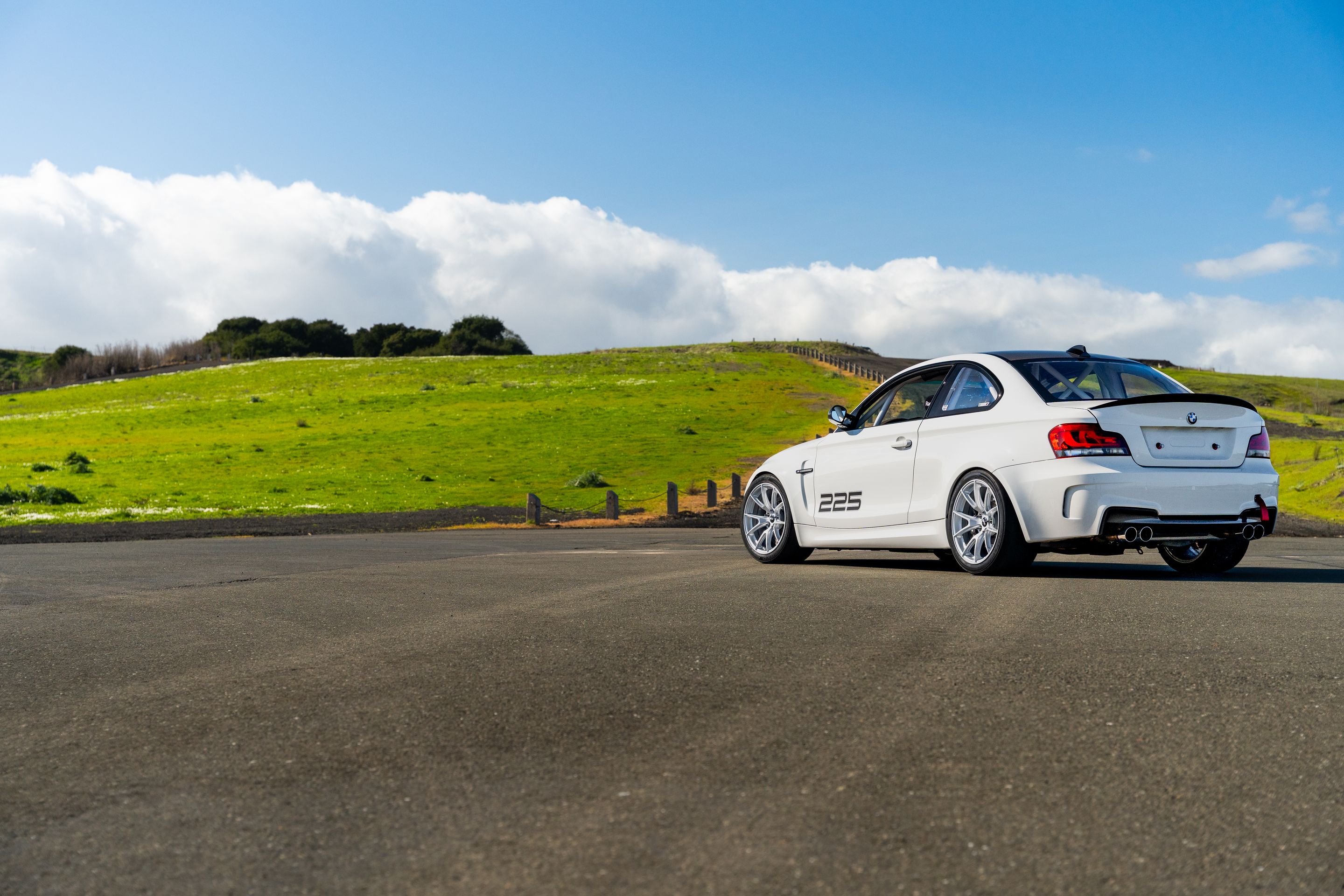 White BMW E82 1M with 18" VS-5 Apex wheels in Race Silver