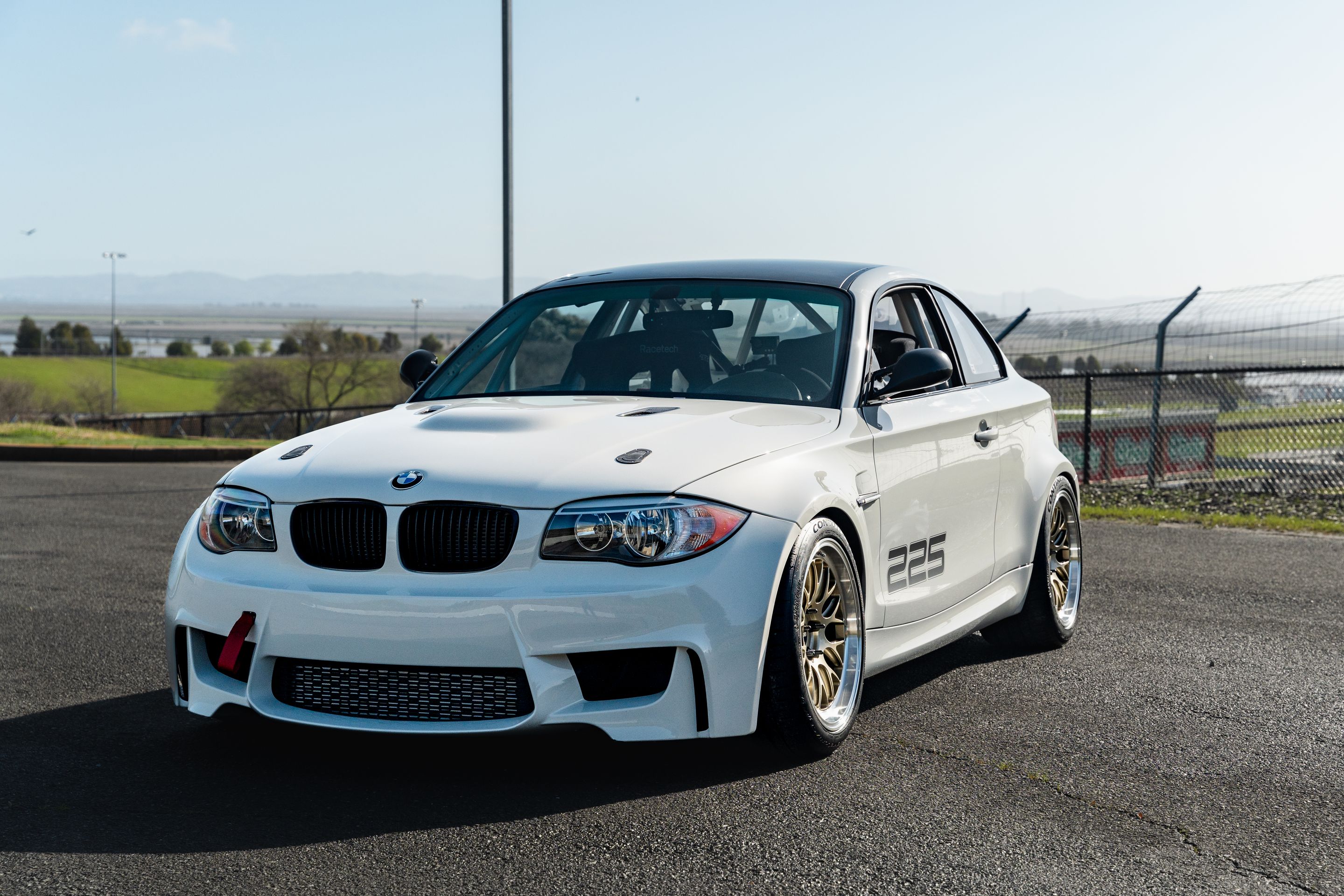 White BMW E82 1M with 18" ML-10RT Apex wheels in Machined Lip Gloss Motorsport Gold