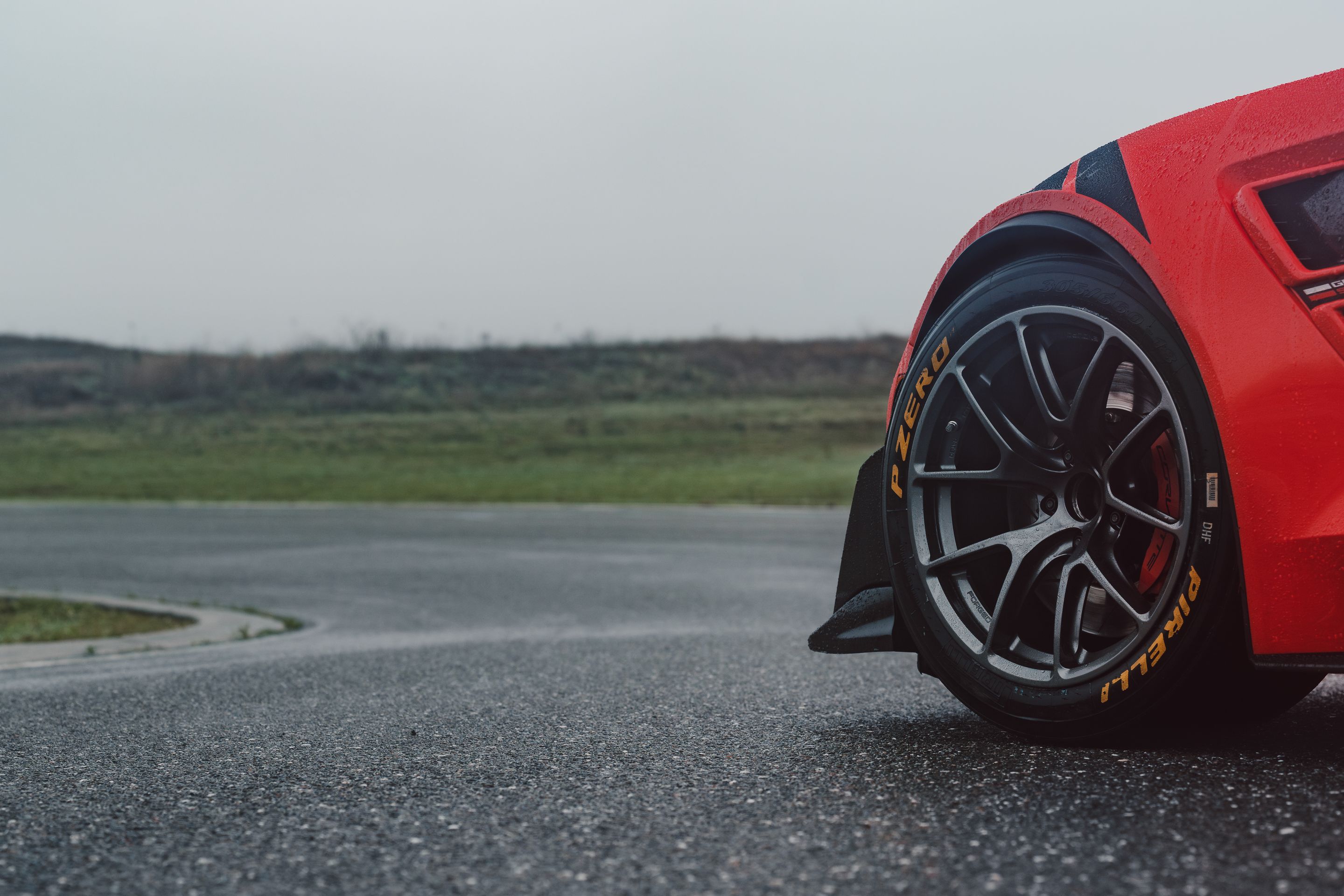 Red Chevrolet C7 Corvette Grand Sport with 18" VS-5RE Apex wheels in Anthracite