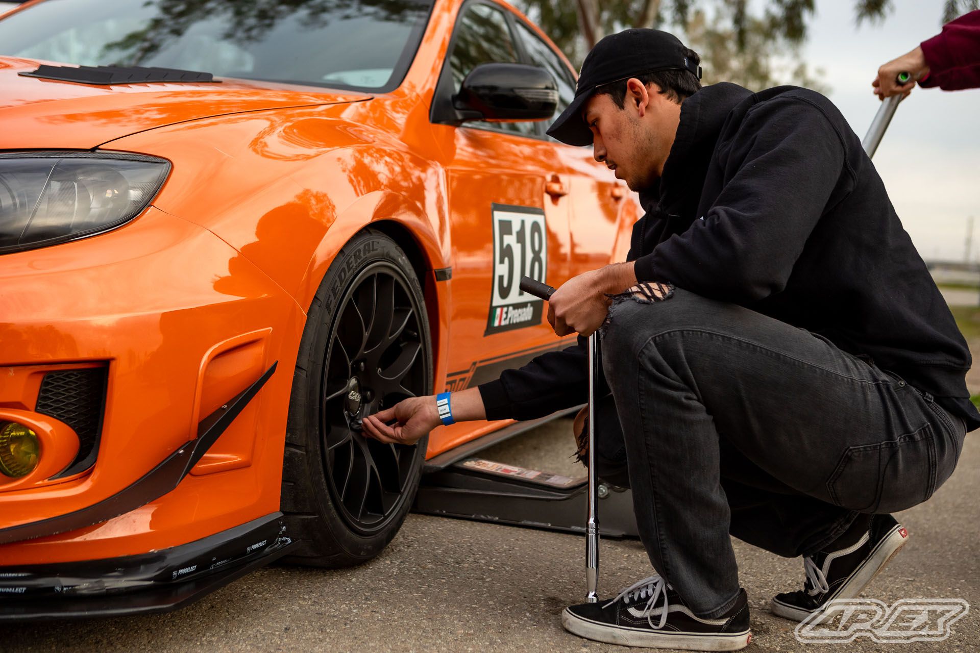 Orange Subaru GR WRX STI with 18" EC-7 Apex wheels in Satin Black