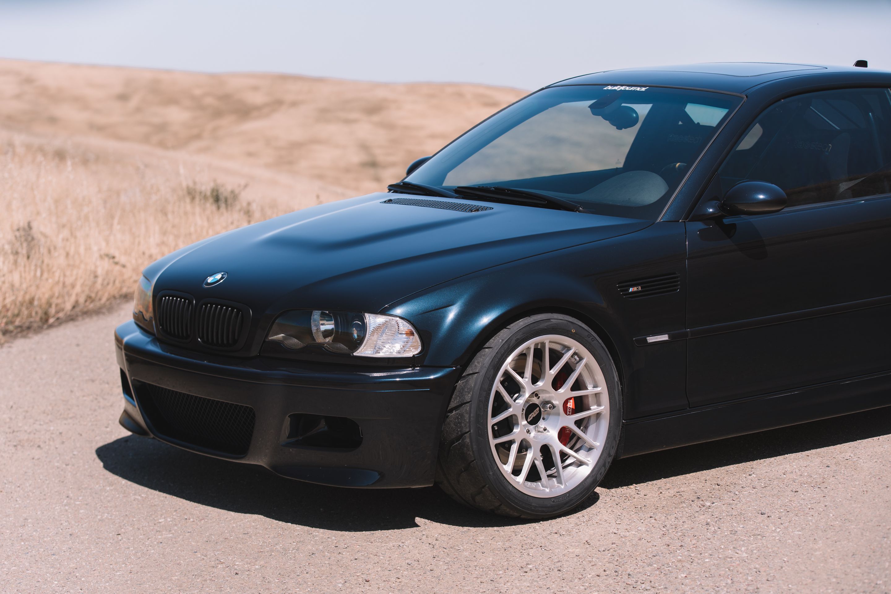 Black BMW E46 M3 with 18" ARC-8R Apex wheels in Brushed Clear