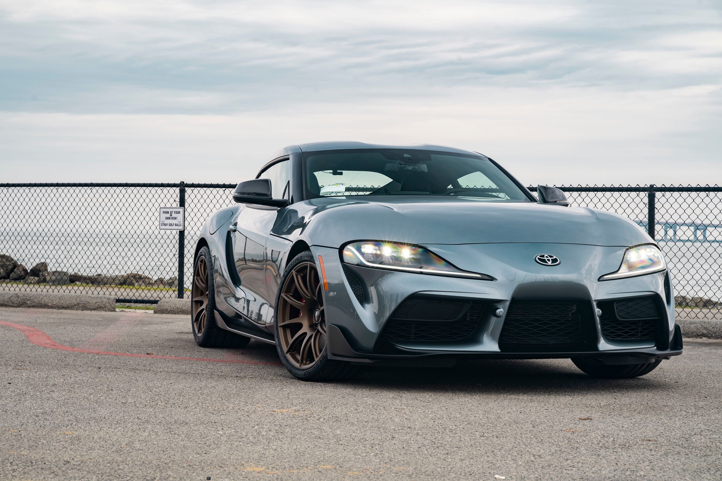 Grey Toyota GR Supra with 19" SM-10 Apex wheels in Satin Bronze