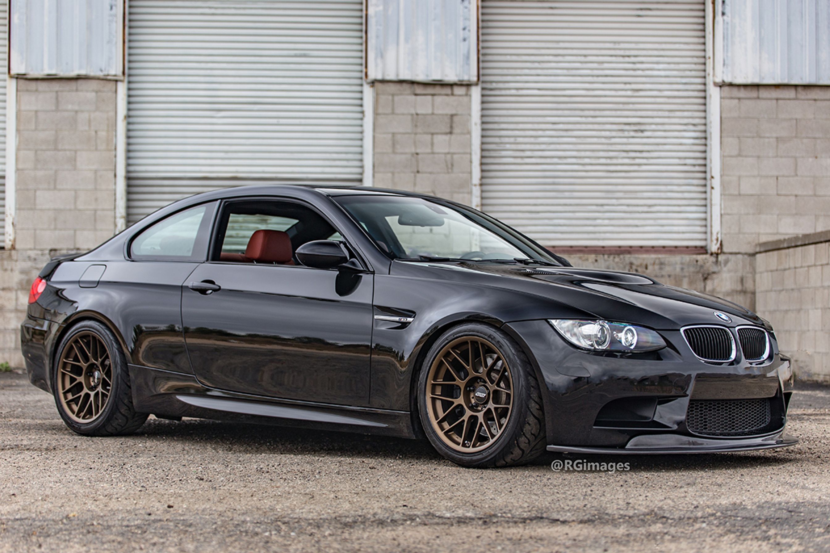Black BMW E92 Coupe M3 with 18" ARC-8 Apex wheels in Satin Bronze