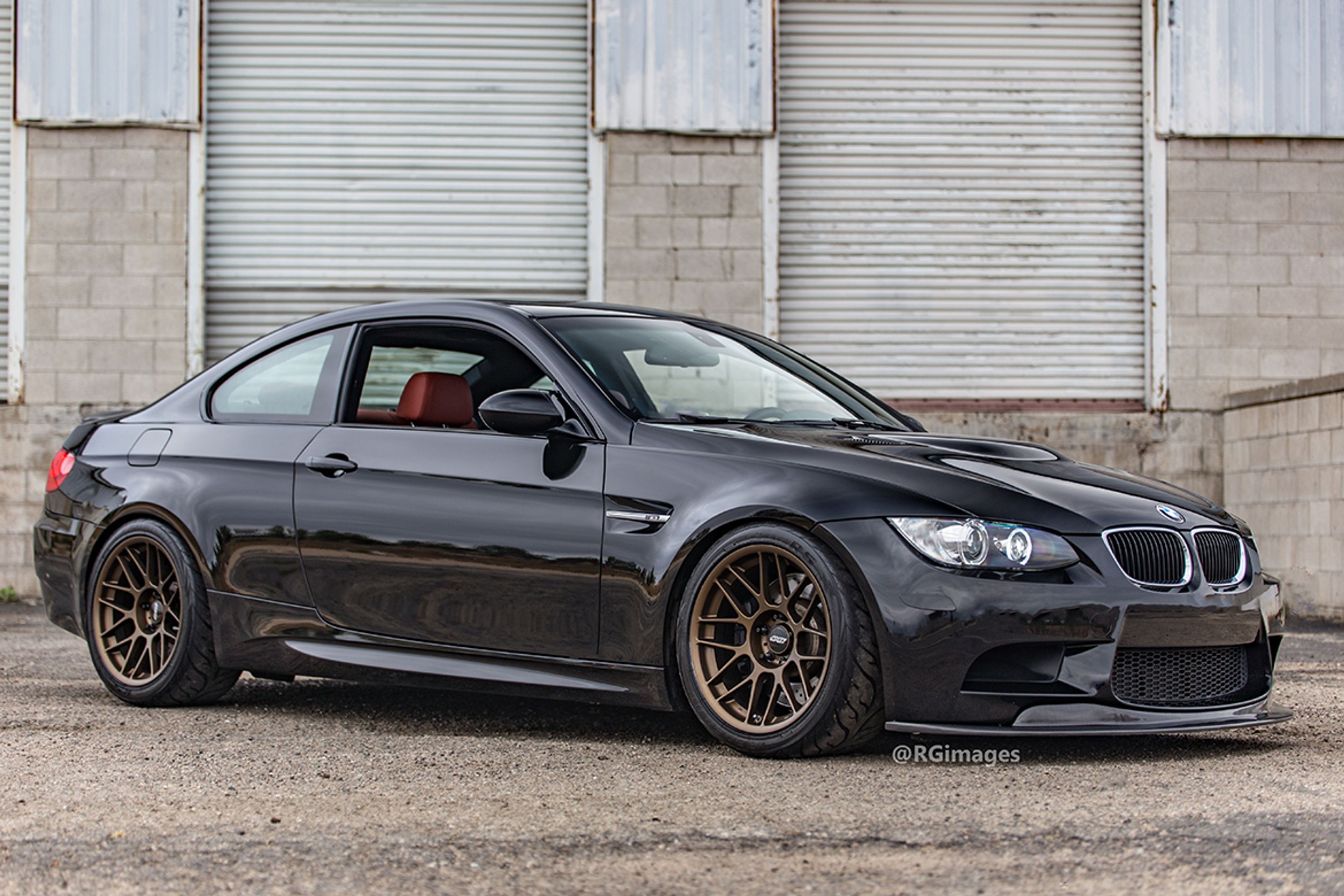 Black BMW E92 Coupe M3 with 18" ARC-8 Apex wheels in Satin Bronze