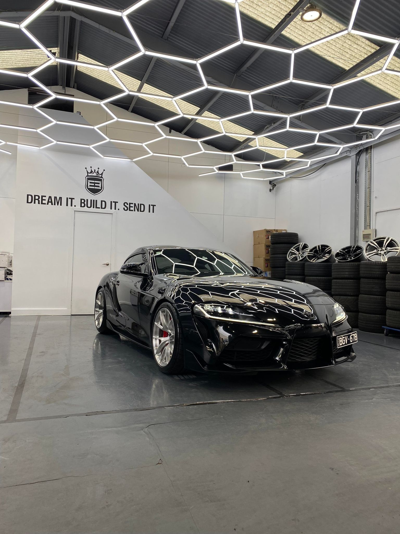 Black Toyota GR Supra with 19" VS-5RS Apex wheels in Brushed Clear