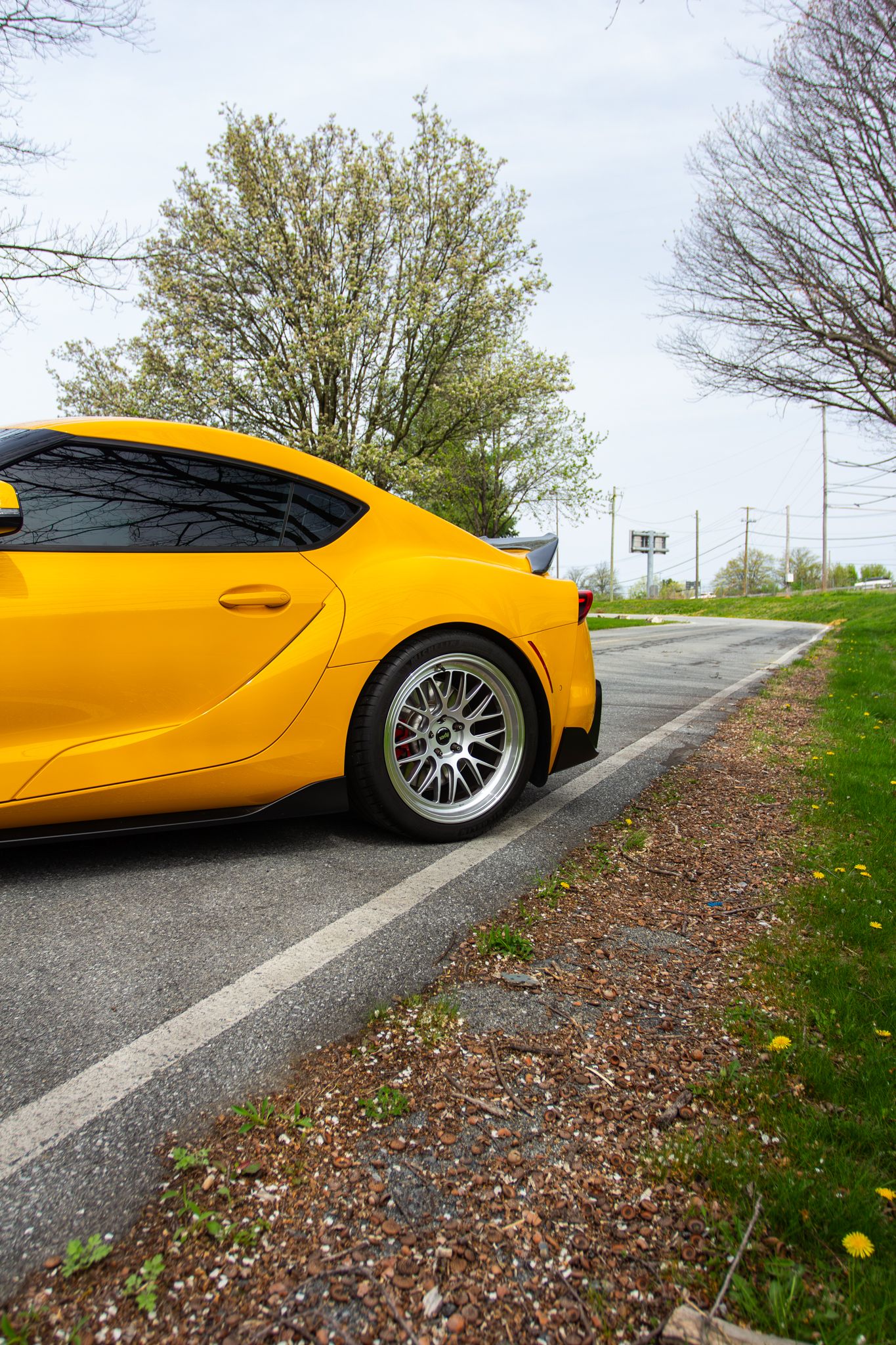 Yellow Toyota GR Supra with 19" ML-10RT Apex wheels in Machined Lip Race Silver